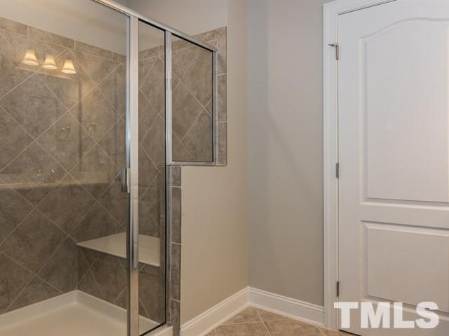 256 Alamosa Place Cary, NC 27519 - Photo 13 of 16 a bathroom with a shower and a sink