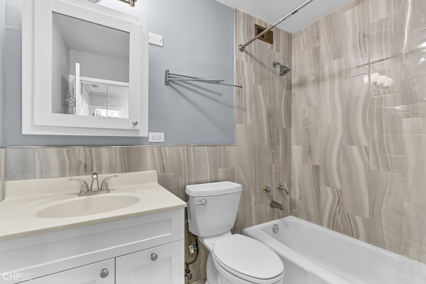 5455 North Sheridan Road, Unit 3501 Chicago, IL 60640 - Photo 15 of 29 a bathroom with a sink a toilet and shower