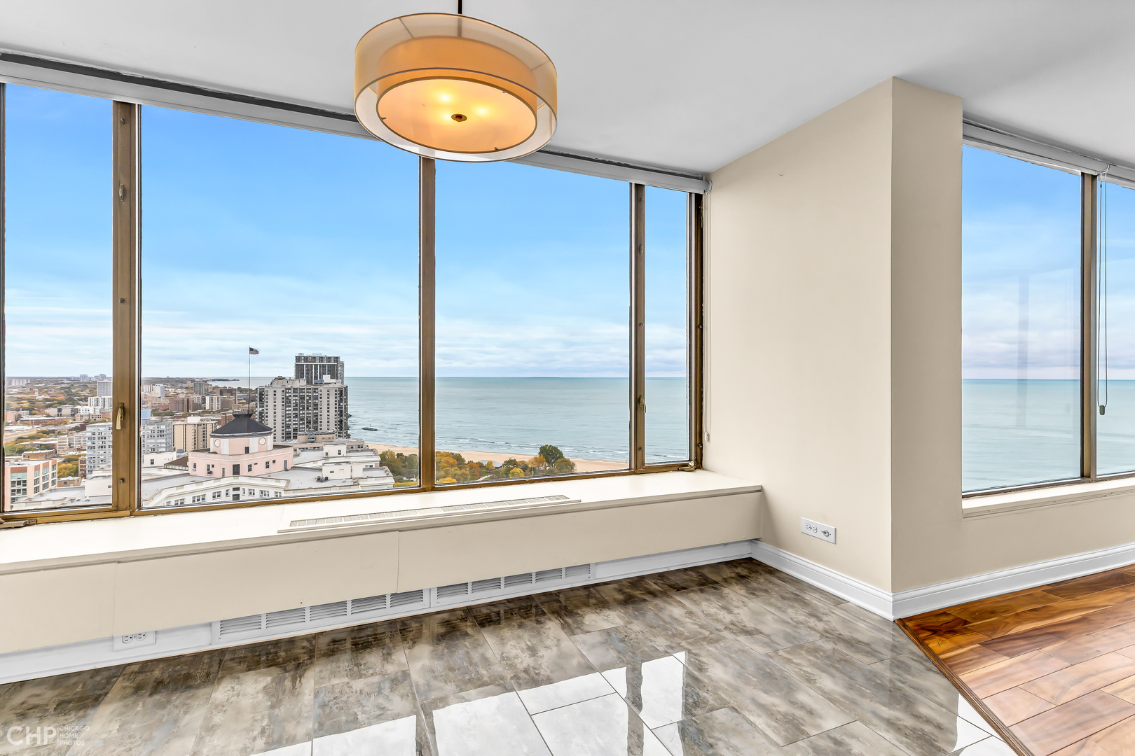 5455 North Sheridan Road, Unit 3501 Chicago, IL 60640 - Photo 6 of 29 a bathroom with a large window and a shower