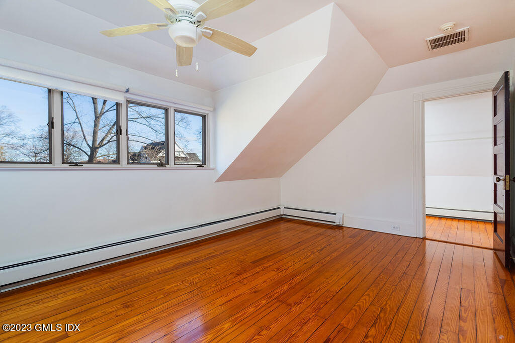 41 B Byram Shore Road Greenwich, CT 06830 - Photo 4 of 16 a view of empty room with wooden floor and fan
