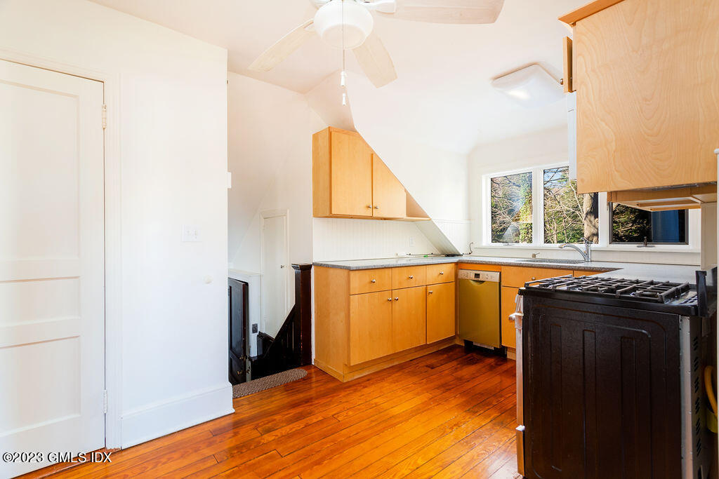41 B Byram Shore Road Greenwich, CT 06830 - Photo 7 of 16 a view of a kitchen with a sink and cabinets