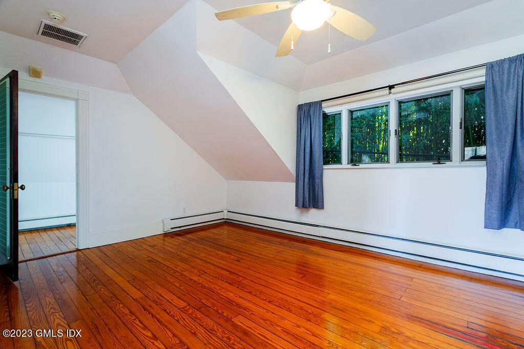41 B Byram Shore Road Greenwich, CT 06830 - Photo 9 of 16 a view of empty room with wooden floor and fan