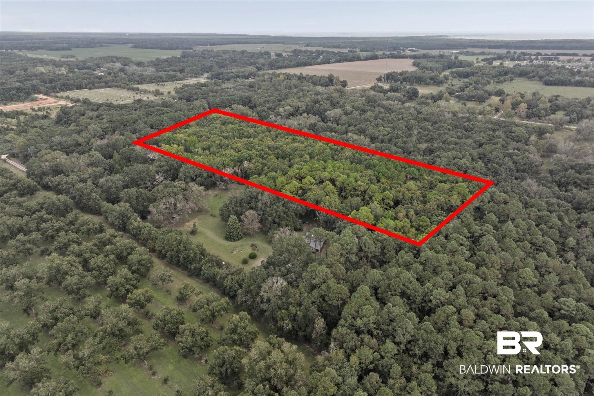 0 Dick Turner Road Grand Bay, AL 36541 - Photo 7 of 13 Aerial view of property's location with property boundaries highlighted and a heavily wooded area