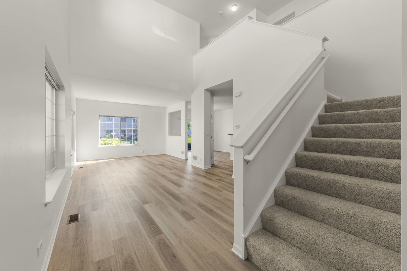 3770 Pope Court Plano, IL 60545 - Photo 12 of 25 a view of entryway and hall with wooden floor