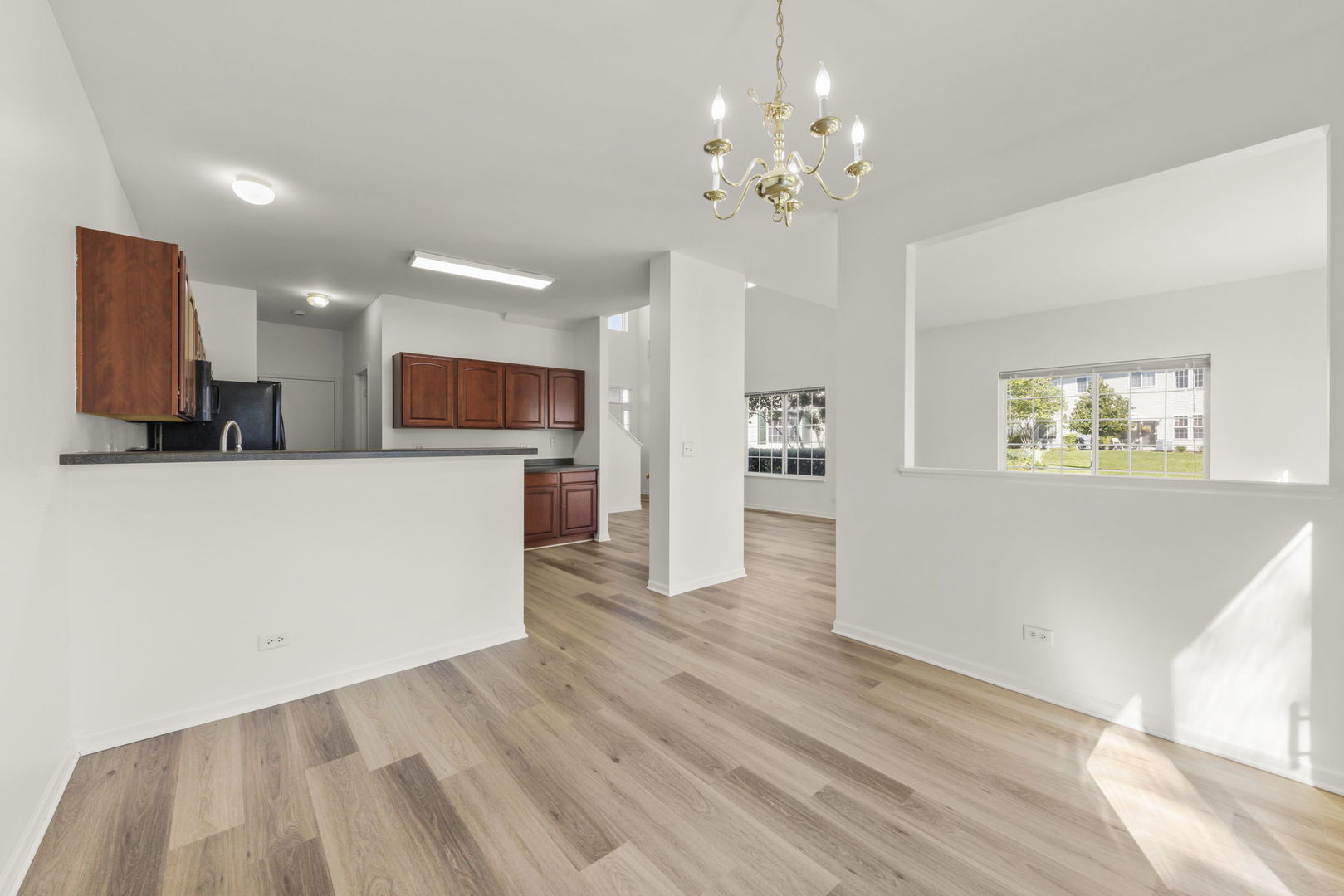 3770 Pope Court Plano, IL 60545 - Photo 6 of 25 a view of a kitchen with microwave and cabinets