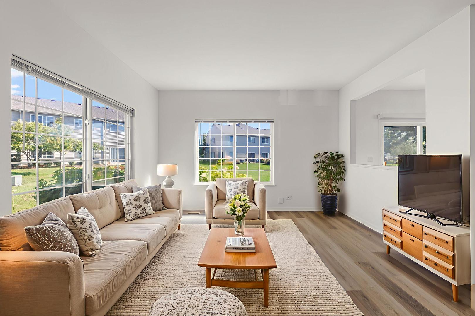 3770 Pope Court Plano, IL 60545 - Photo 8 of 25 a living room with furniture and a flat screen tv