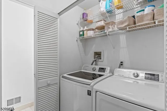 a view of a livingroom with furniture and staircase
