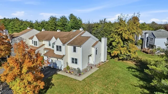 a view of a room with furniture and wooden floor