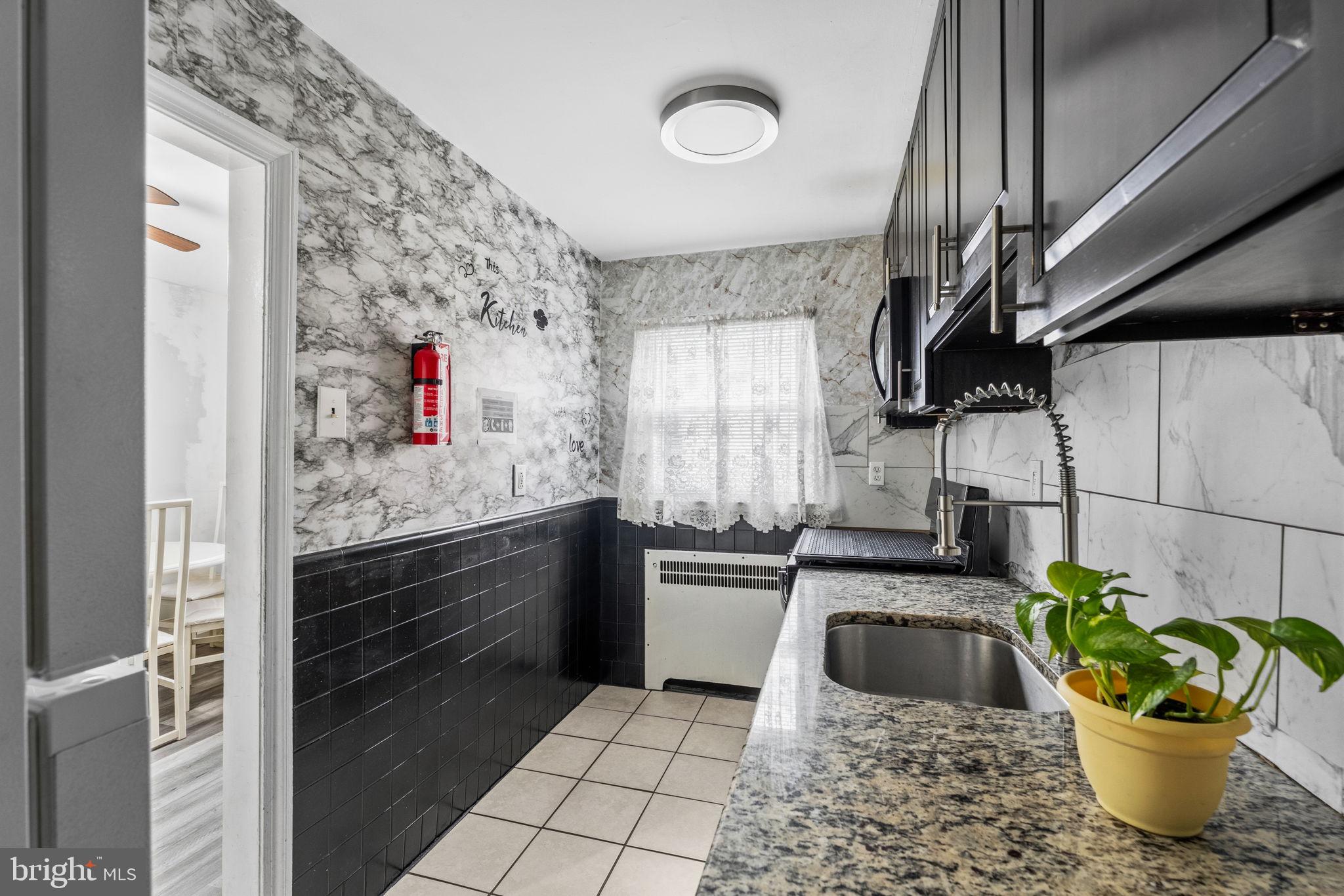 540 Snowden Road Upper Darby, PA 19082 - Photo 11 of 30 a kitchen with a sink appliances and cabinets