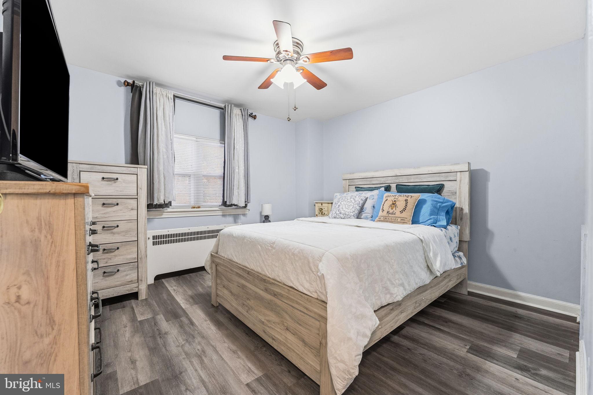 540 Snowden Road Upper Darby, PA 19082 - Photo 12 of 30 a bedroom with a bed and a flat screen tv