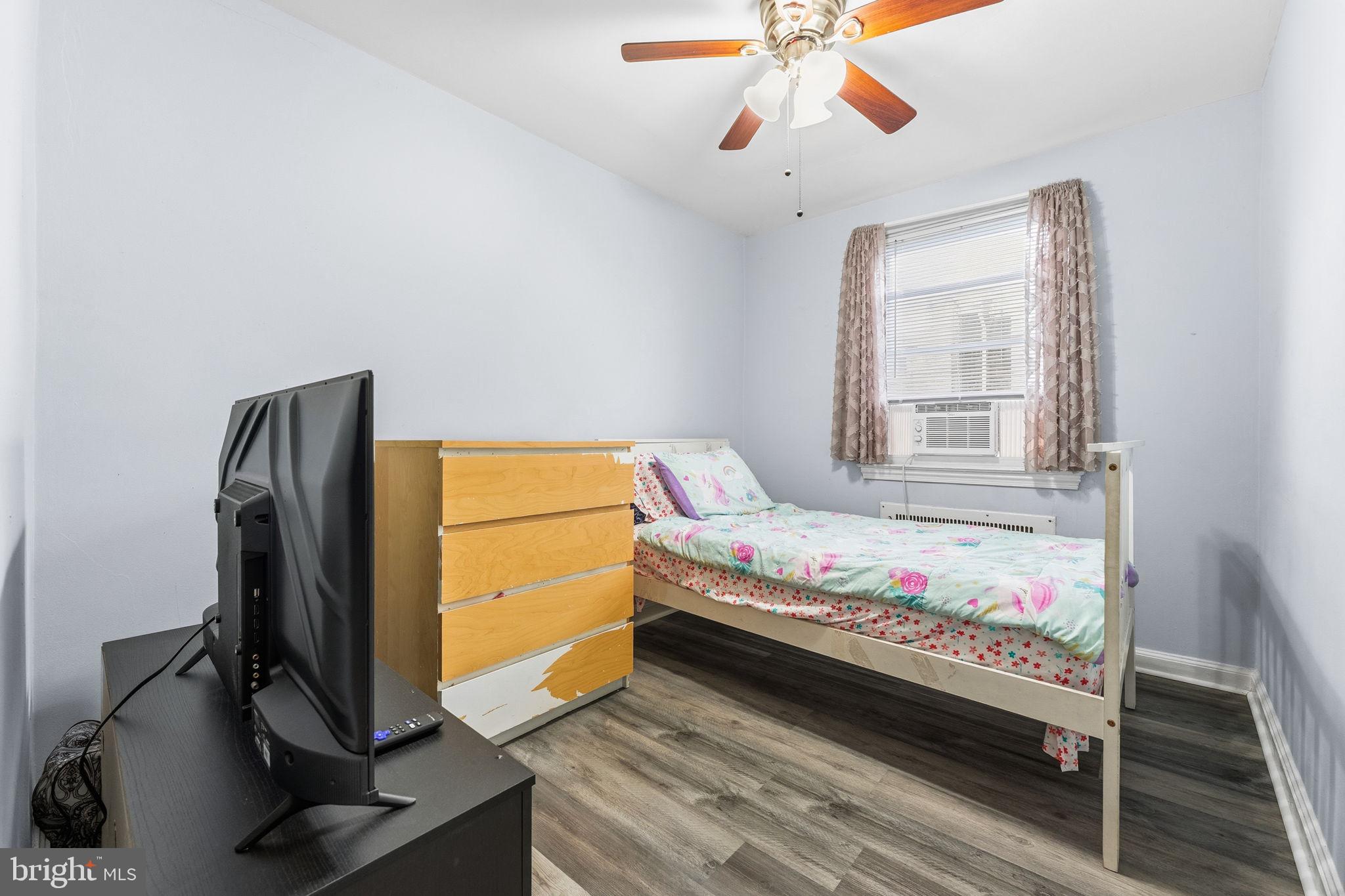 540 Snowden Road Upper Darby, PA 19082 - Photo 14 of 30 a bedroom with a bed and a flat screen tv