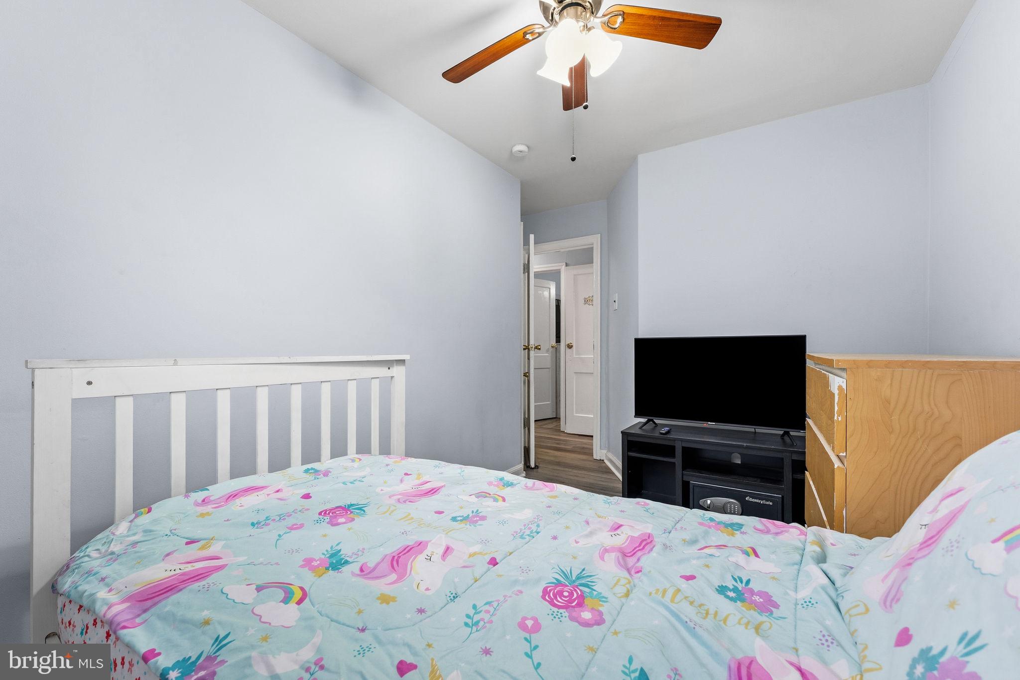 540 Snowden Road Upper Darby, PA 19082 - Photo 15 of 30 a bedroom with a bed and a flat screen tv