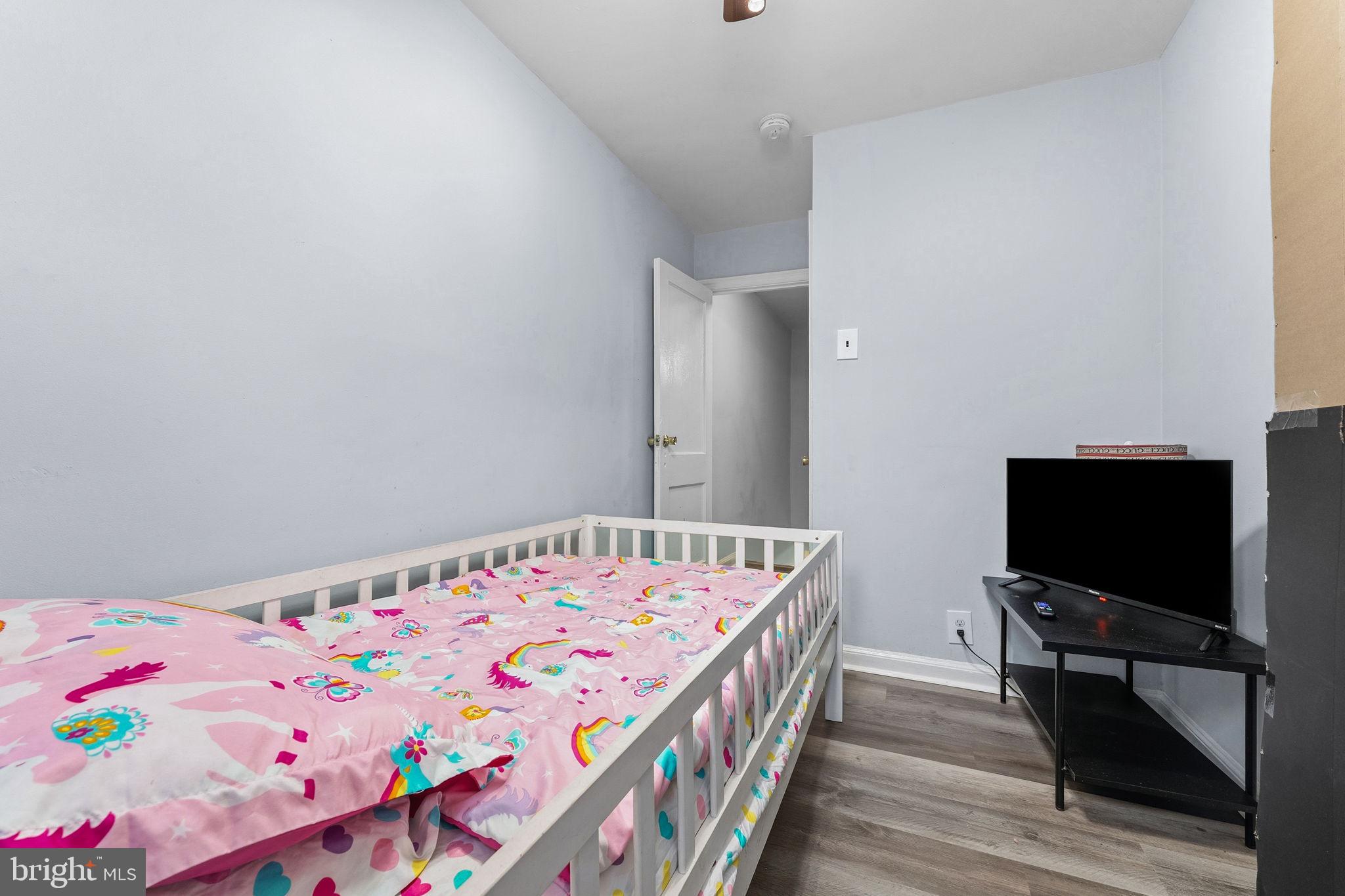 540 Snowden Road Upper Darby, PA 19082 - Photo 17 of 30 a bedroom with a bed and a flat screen tv