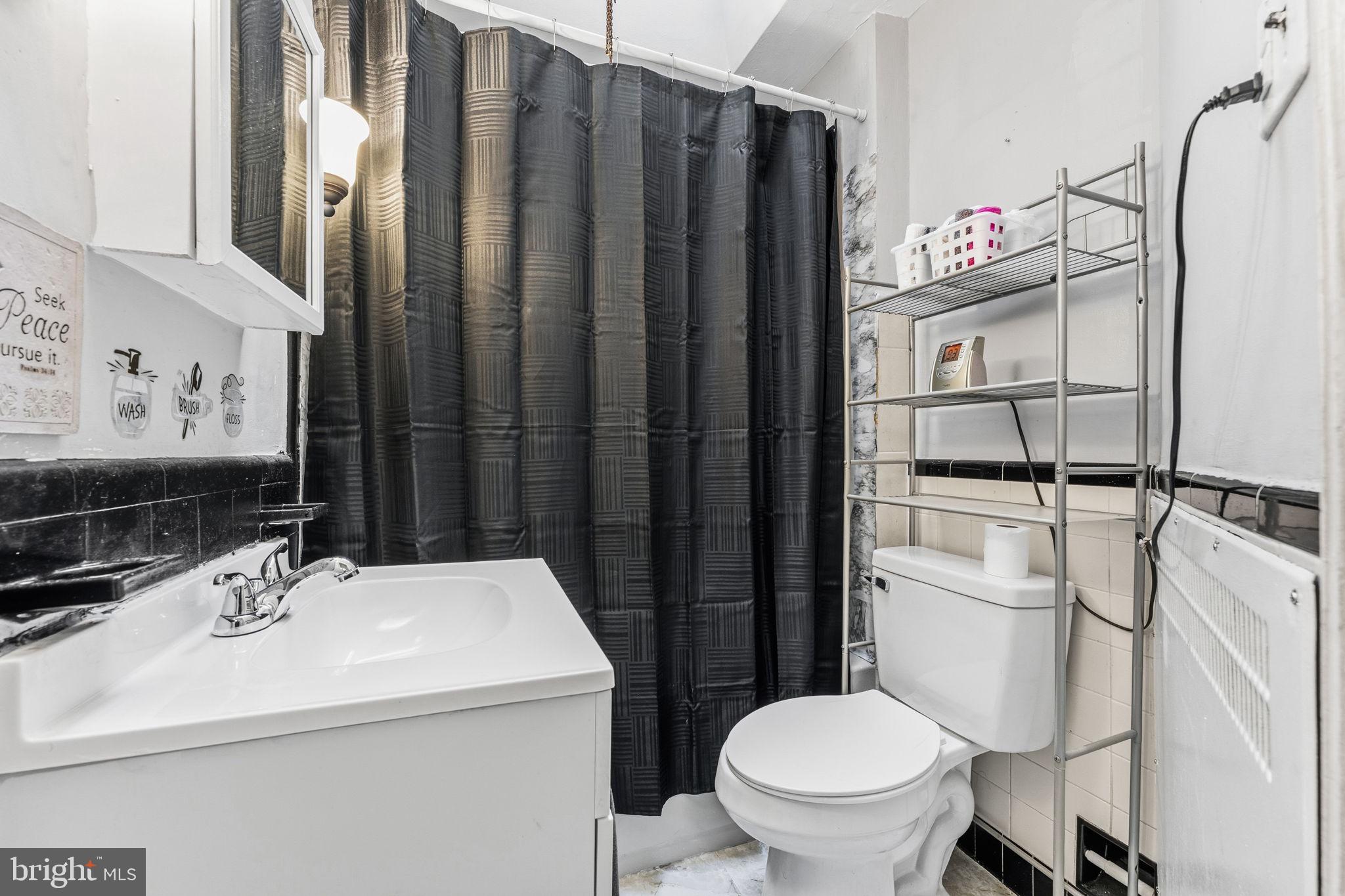 540 Snowden Road Upper Darby, PA 19082 - Photo 18 of 30 a bathroom with a sink toilet and shower