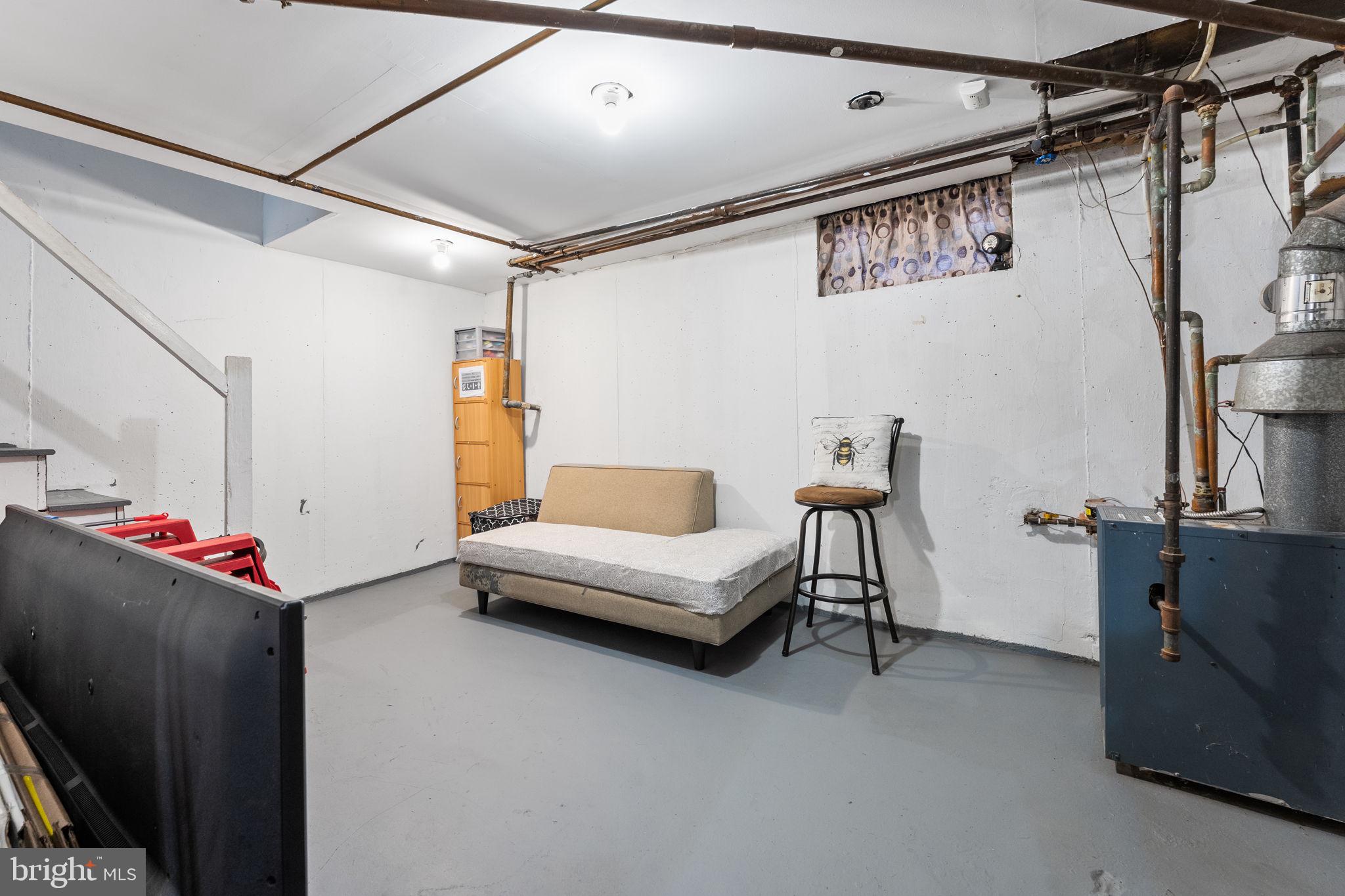 540 Snowden Road Upper Darby, PA 19082 - Photo 20 of 30 a living room with furniture and a flat screen tv