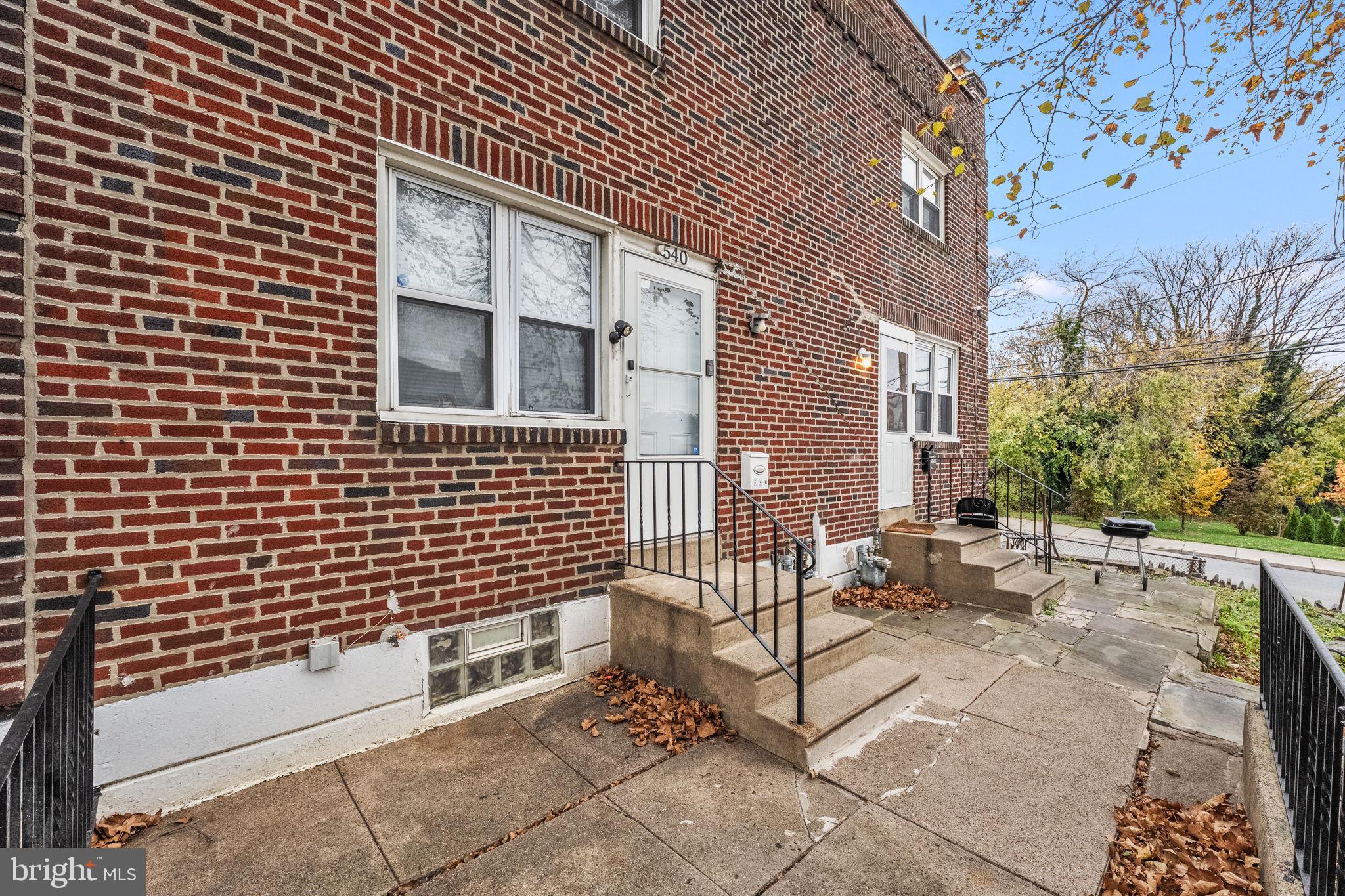 540 Snowden Road Upper Darby, PA 19082 - Photo 28 of 30 a view of a patio with a table and chairs and wooden fence