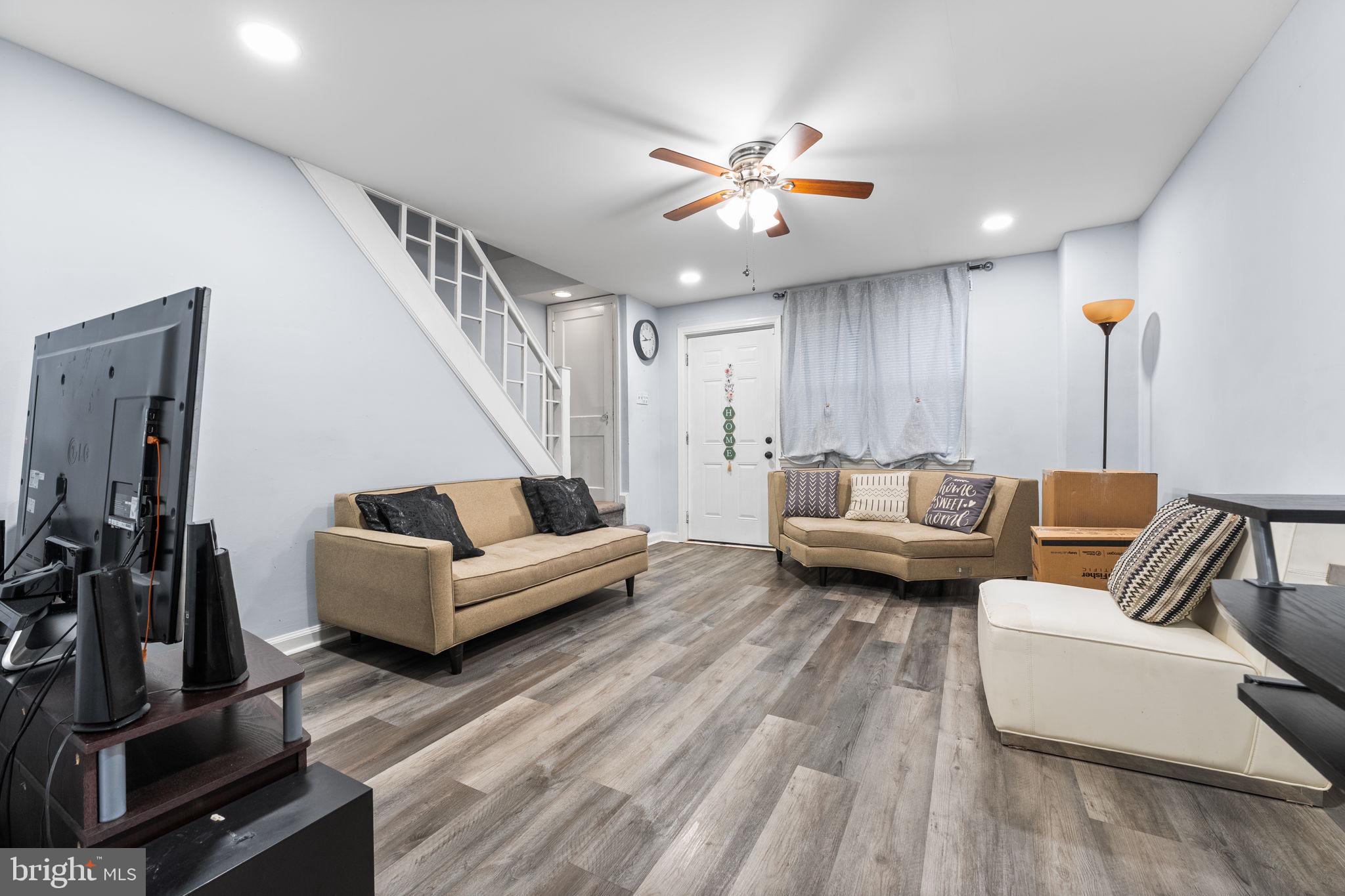 540 Snowden Road Upper Darby, PA 19082 - Photo 5 of 30 a living room with furniture and a flat screen tv