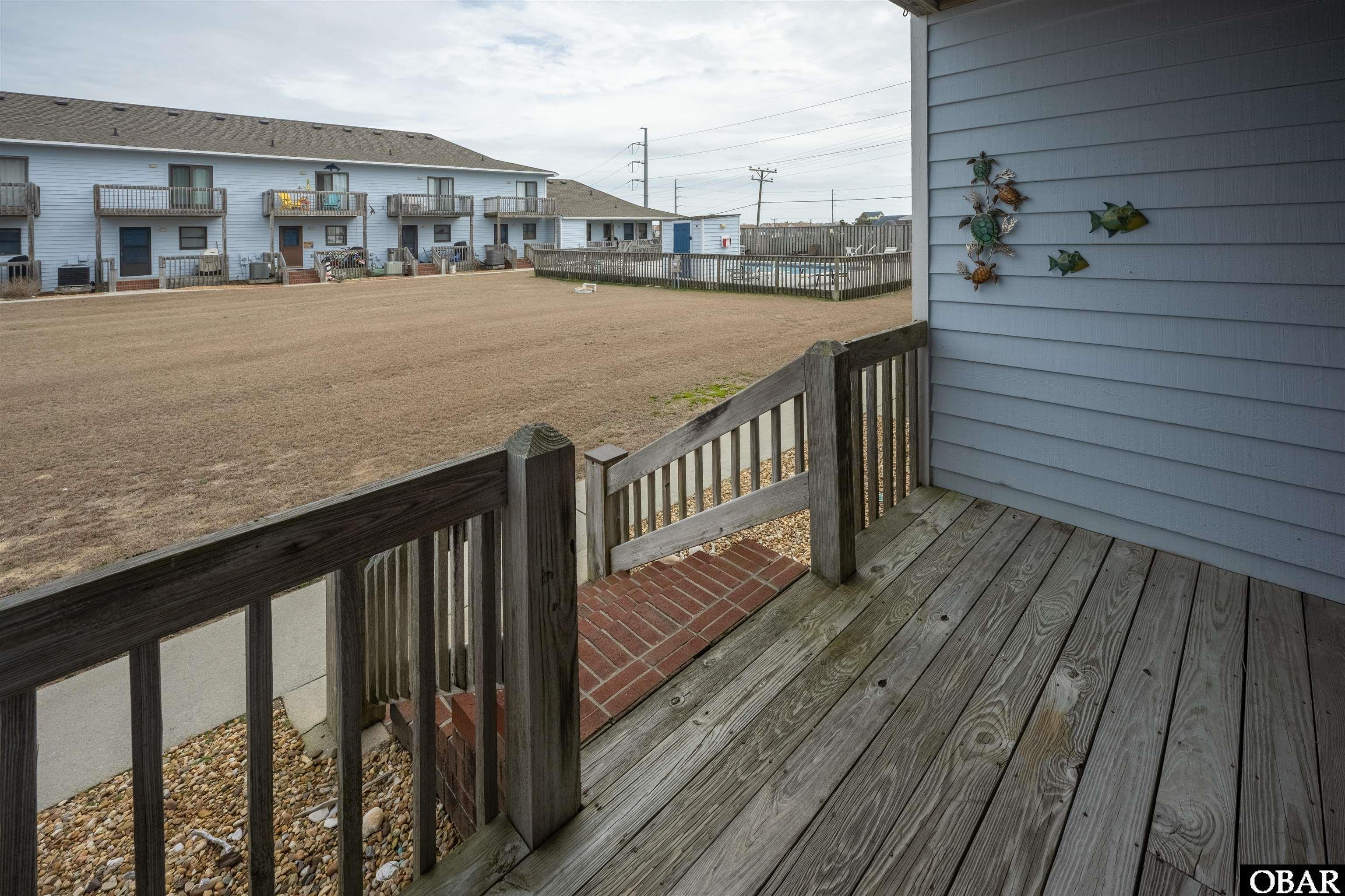 128 West Kitty Hawk Road, Unit B5 Kitty Hawk, NC 27949 - Photo 24 of 36 covered deck off living room