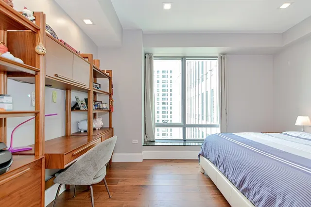 a bedroom with furniture and a window