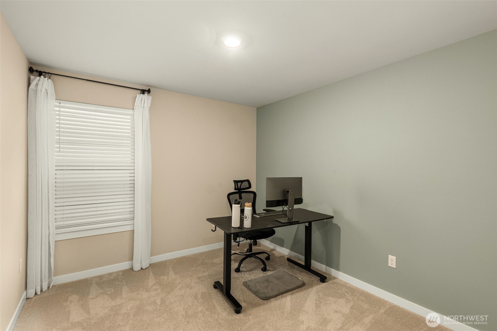 19410 28th Drive Southeast Bothell, WA 98012 - Photo 26 of 37 a view of a workspace with furniture and a window