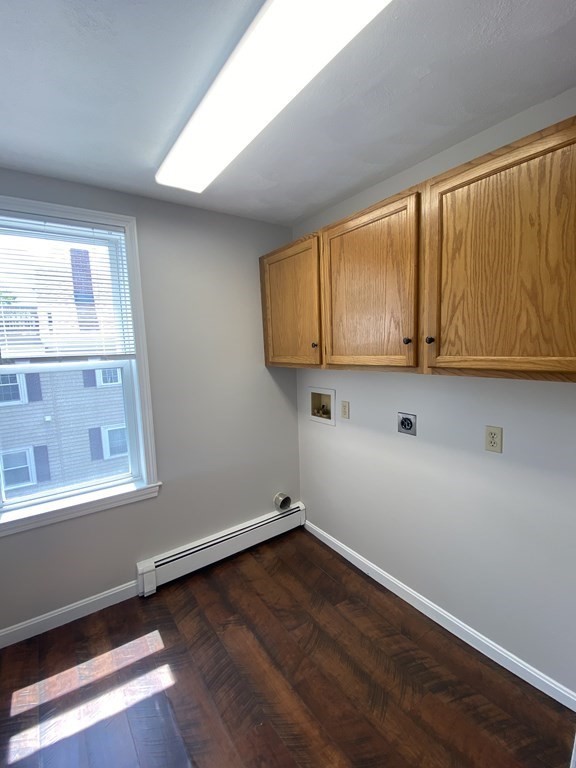 36 Upham Street, Unit 2 Salem, MA 01970 - Photo 12 of 13 a view of a kitchen with wooden floor and cabinets