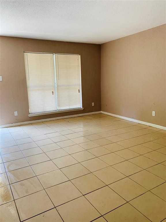 5625 Antoine Drive, Unit 607 Houston, TX 77091 - Photo 7 of 15 a view of an empty room with a window