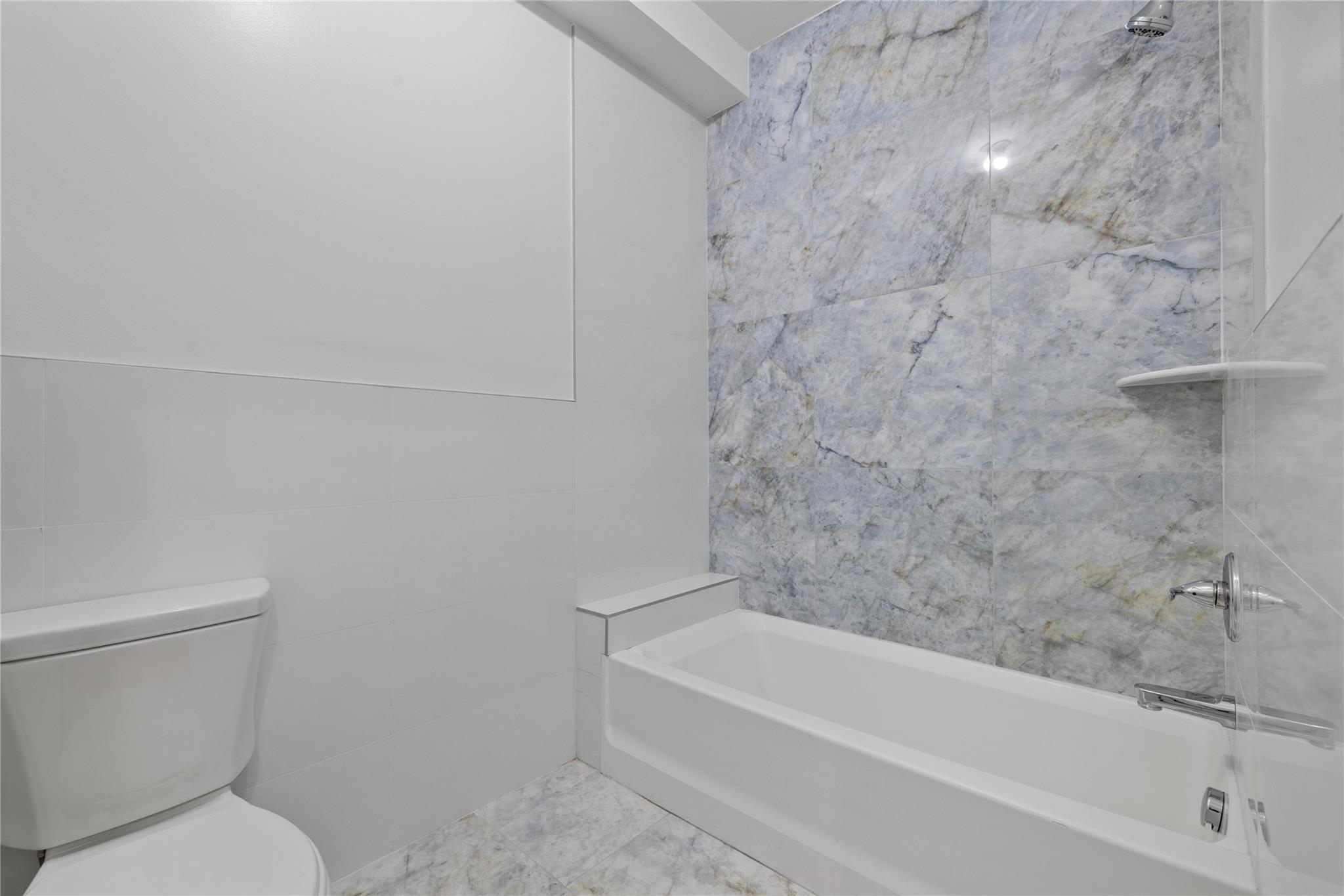 151 Blauvelt Road, Unit 116 Monsey, NY 10952 - Photo 12 of 12 a bathroom with a toilet and bathtub