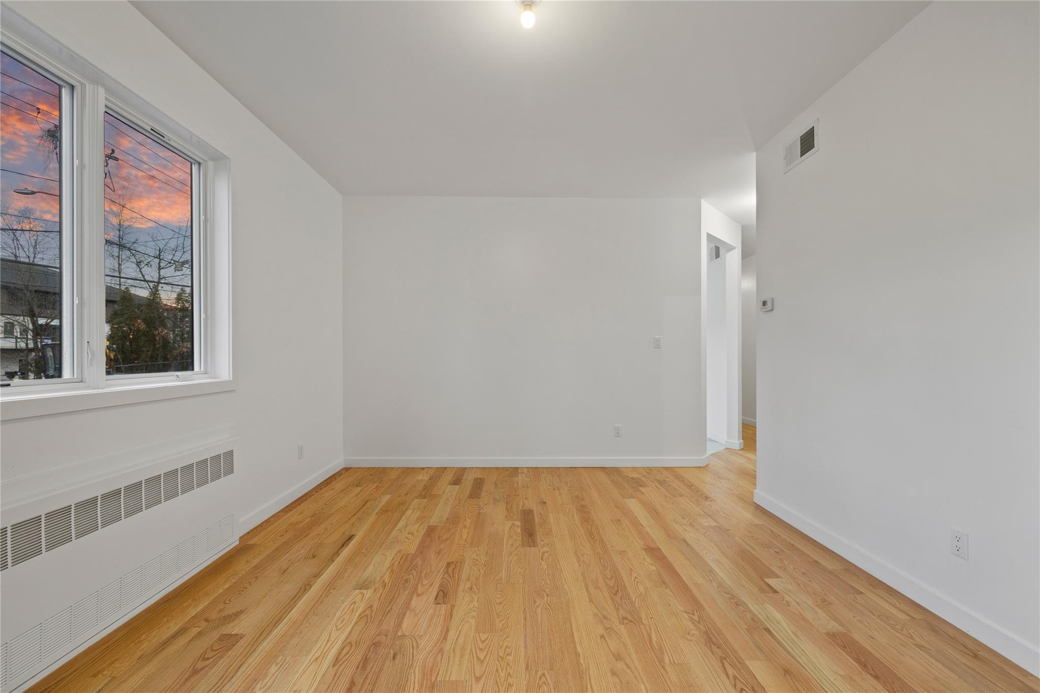 151 Blauvelt Road, Unit 116 Monsey, NY 10952 - Photo 3 of 12 a view of a room with wooden floor and window