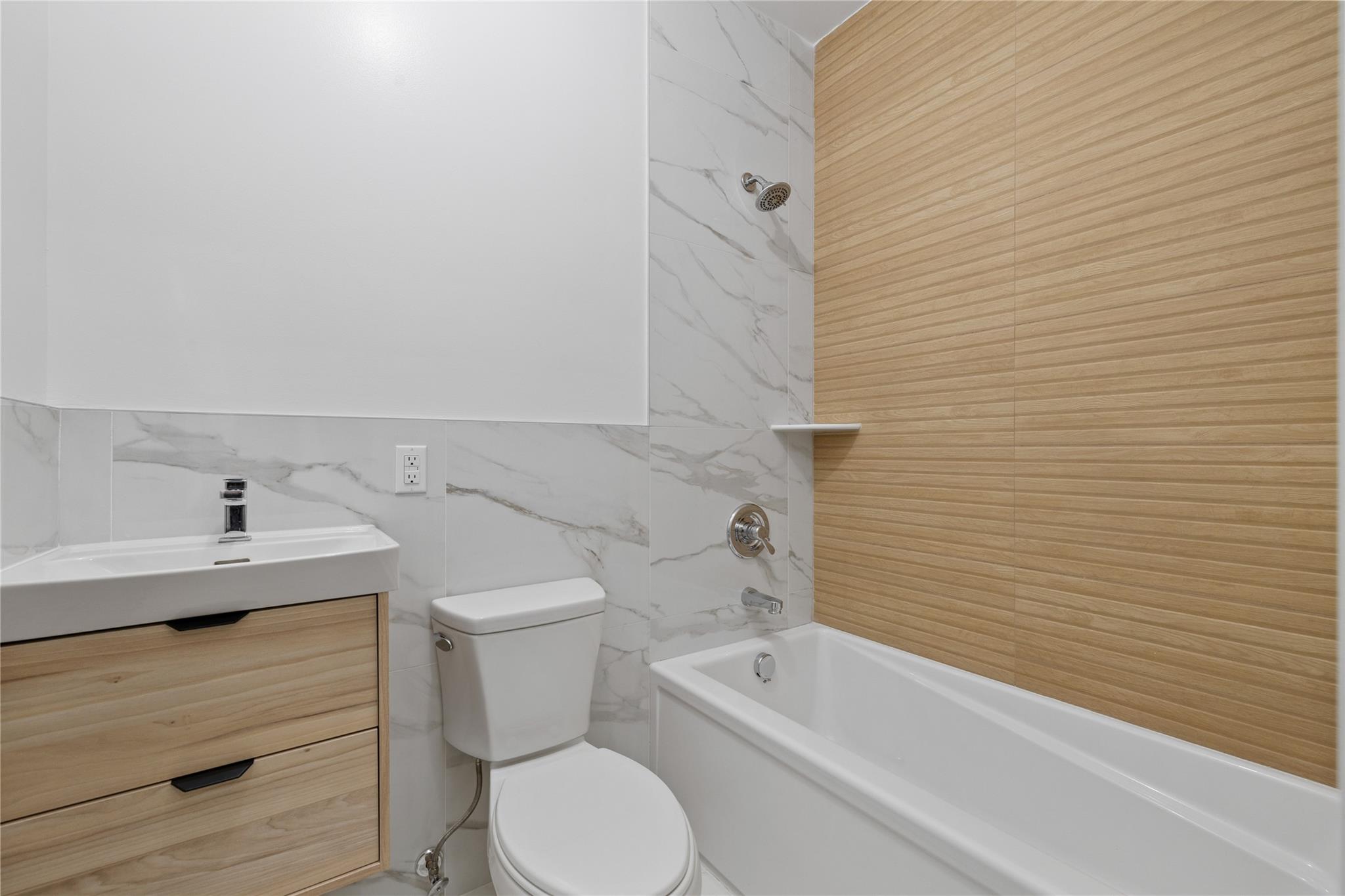 151 Blauvelt Road, Unit 116 Monsey, NY 10952 - Photo 7 of 12 a bathroom with a sink a toilet and bathtub