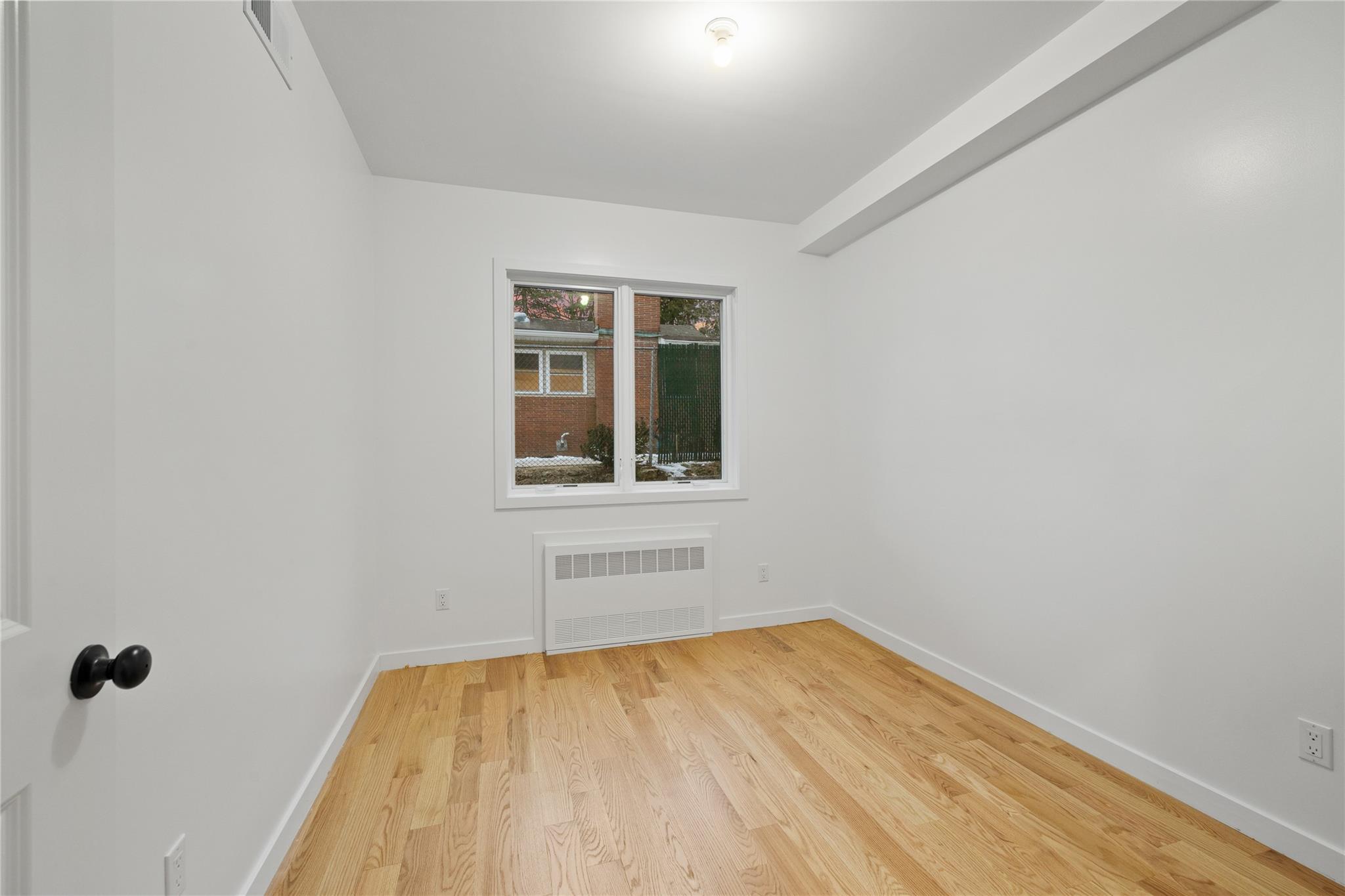 151 Blauvelt Road, Unit 116 Monsey, NY 10952 - Photo 10 of 12 a view of empty room with wooden floor and fan