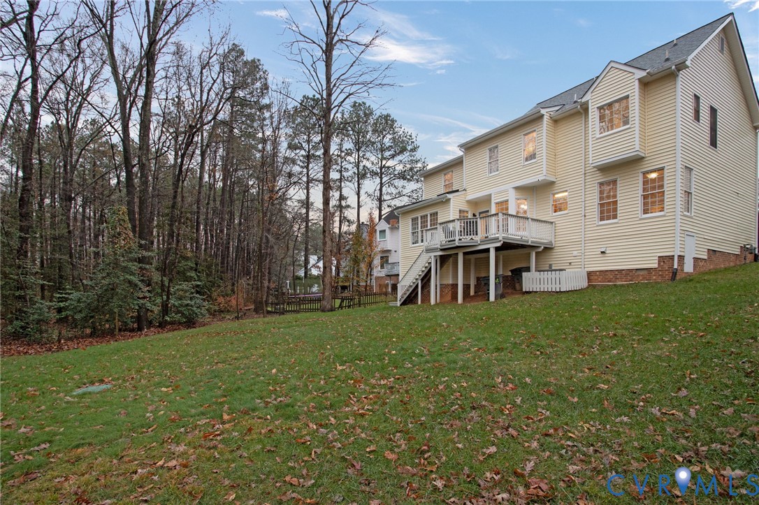 13914 Sagebrook Road Midlothian, VA 23112 - Photo 36 of 49 a view of a white house with a big yard and large trees