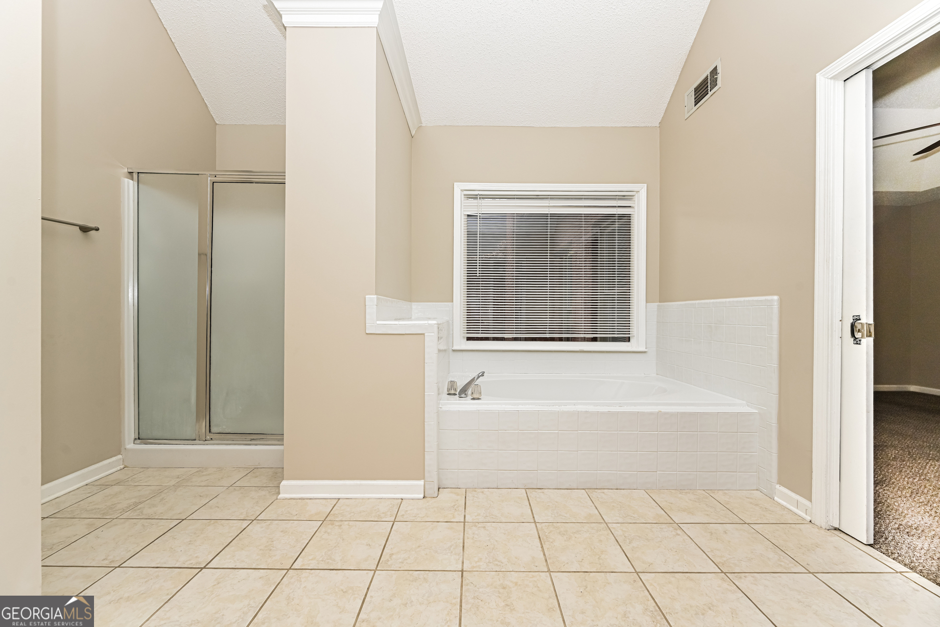 100 Red Maple Drive Hampton, GA 30228 - Photo 11 of 22 a bathroom with a bathtub and shower