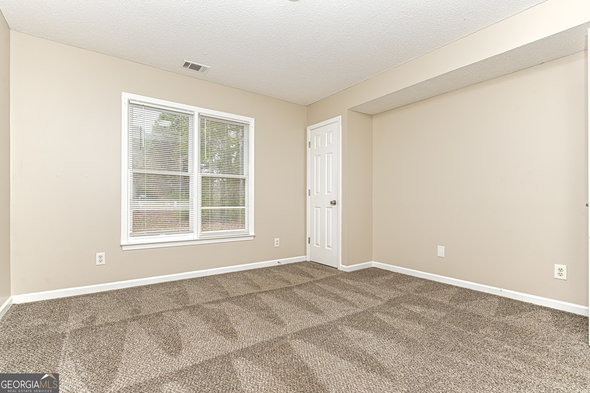 100 Red Maple Drive Hampton, GA 30228 - Photo 12 of 22 a view of an empty room with a window