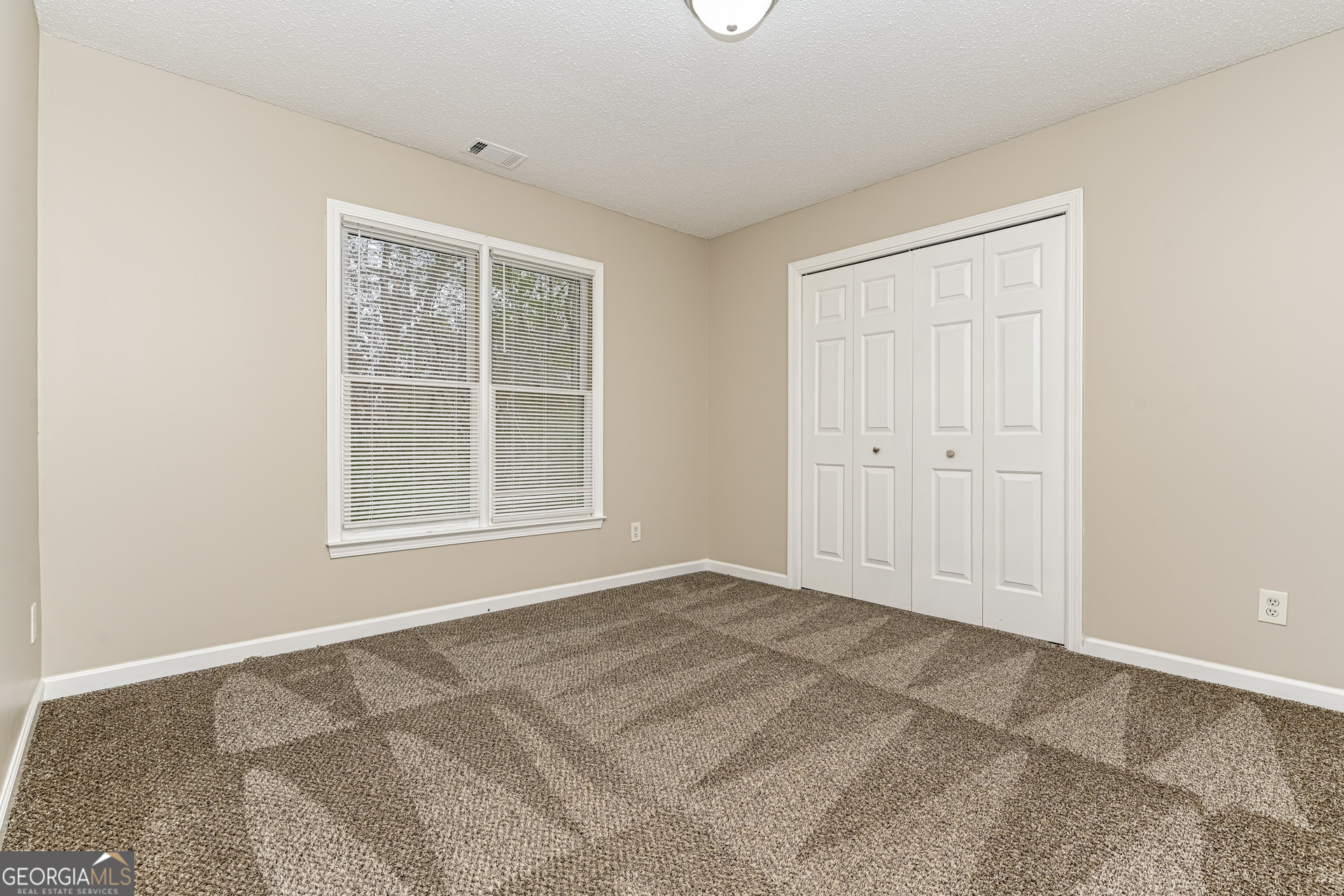 100 Red Maple Drive Hampton, GA 30228 - Photo 13 of 22 an empty room with windows