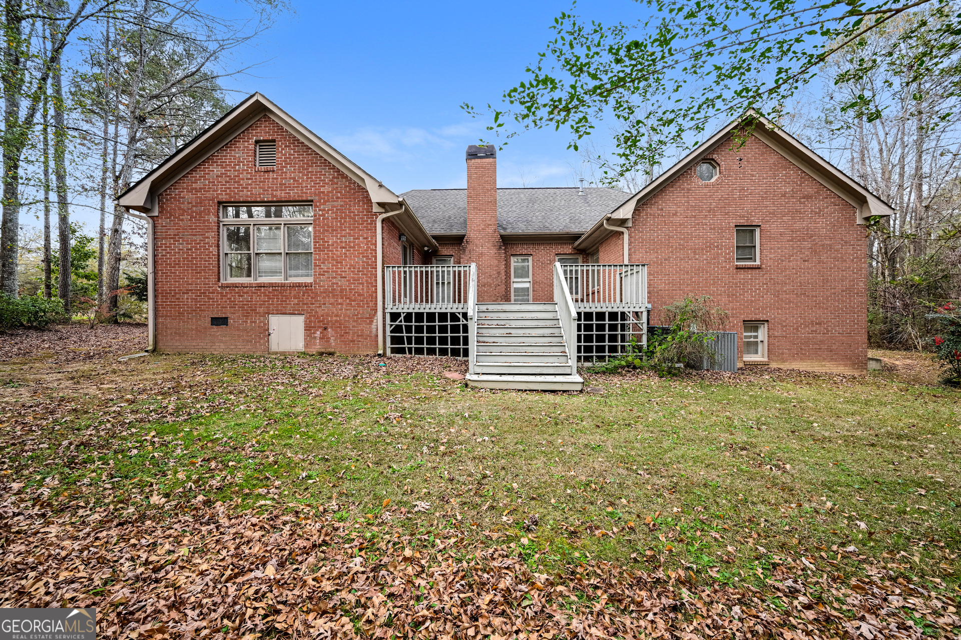 100 Red Maple Drive Hampton, GA 30228 - Photo 16 of 22 a front view of a house with a garden