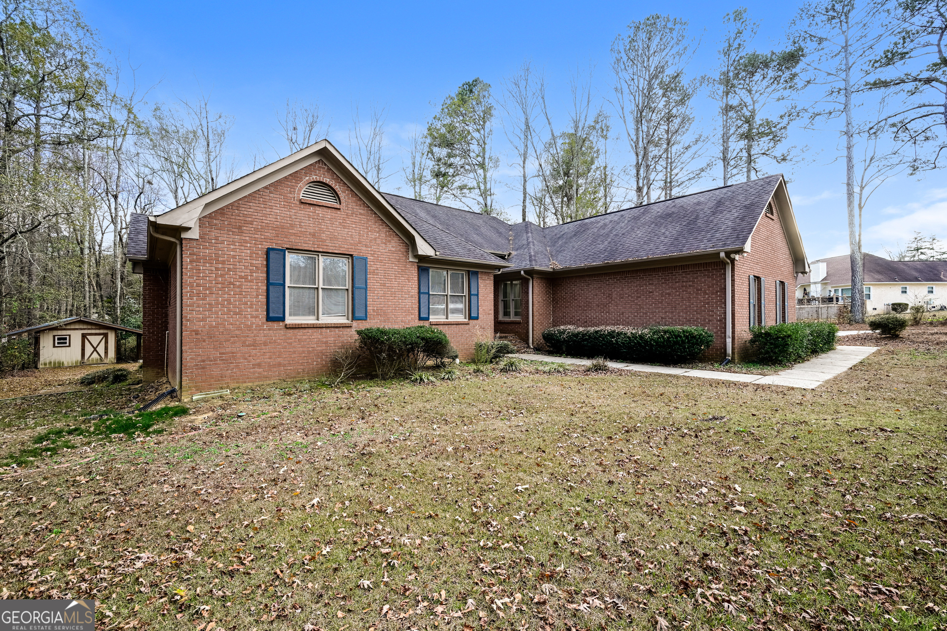 100 Red Maple Drive Hampton, GA 30228 - Photo 2 of 22 a view of a house with a yard and garage