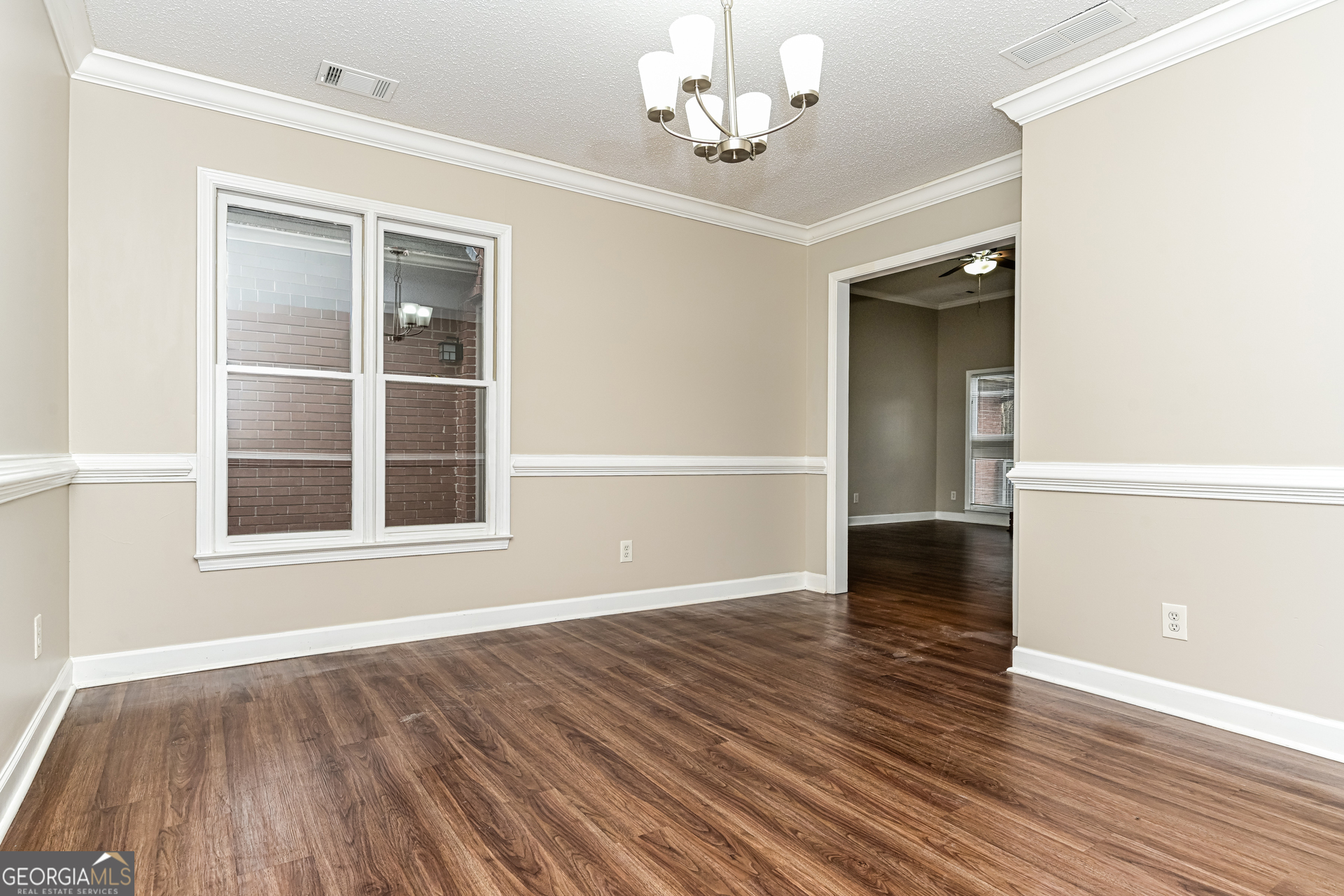 100 Red Maple Drive Hampton, GA 30228 - Photo 4 of 22 wooden floor in an empty room with a window