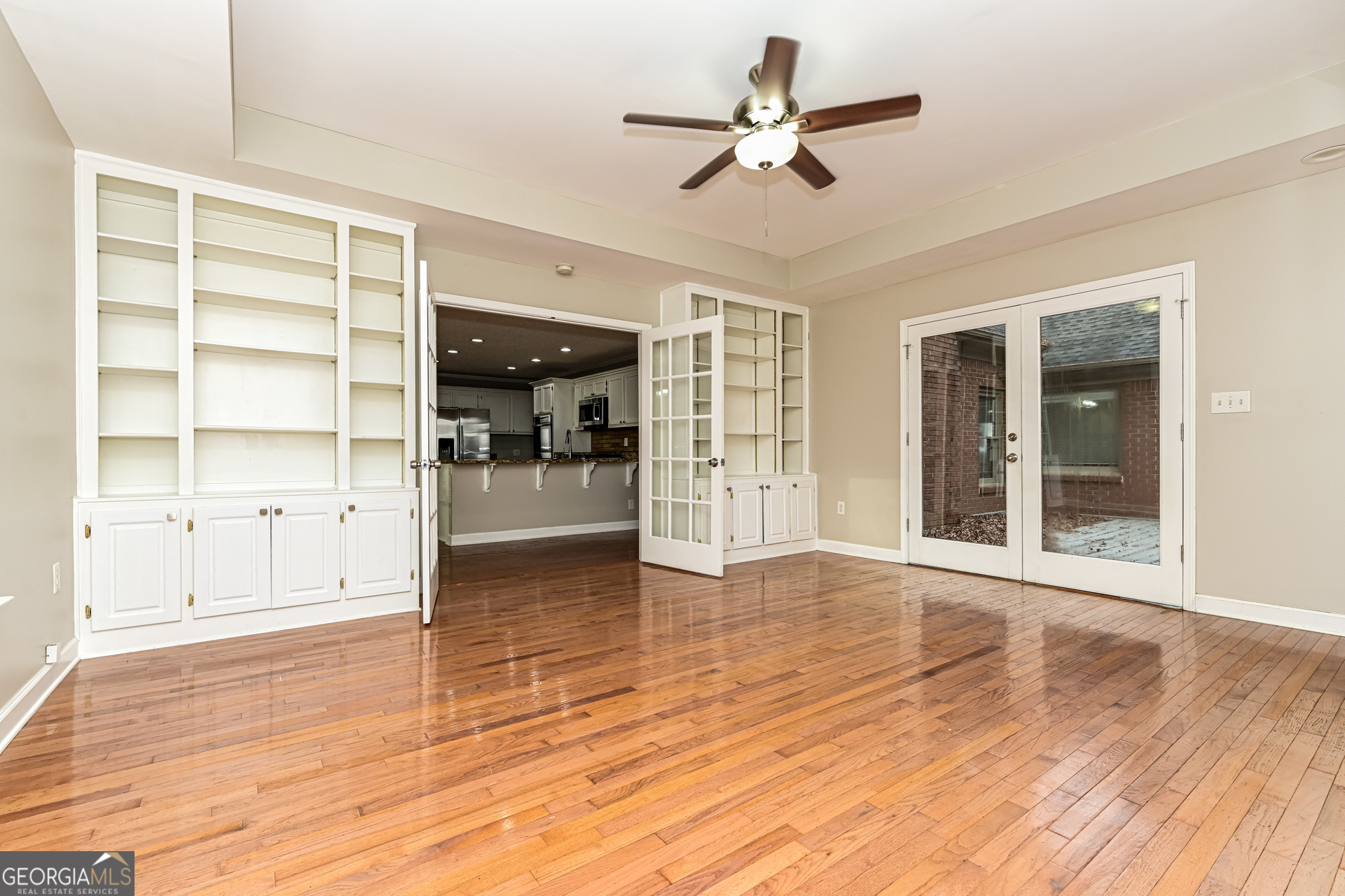 100 Red Maple Drive Hampton, GA 30228 - Photo 5 of 22 an empty room with wooden floor and windows