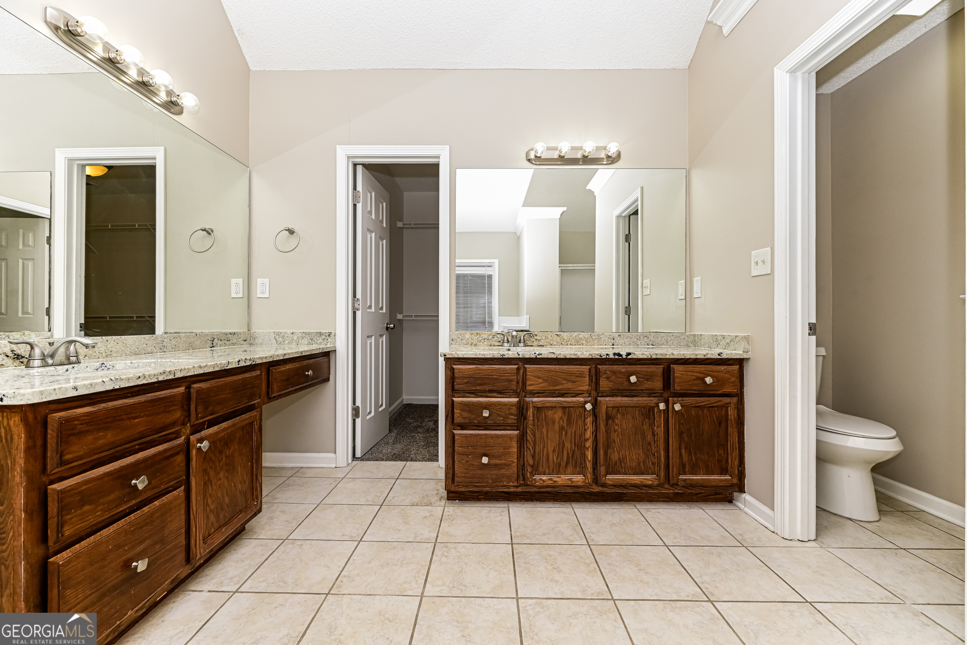 100 Red Maple Drive Hampton, GA 30228 - Photo 10 of 22 a bathroom with a granite countertop sink toilet and a mirror