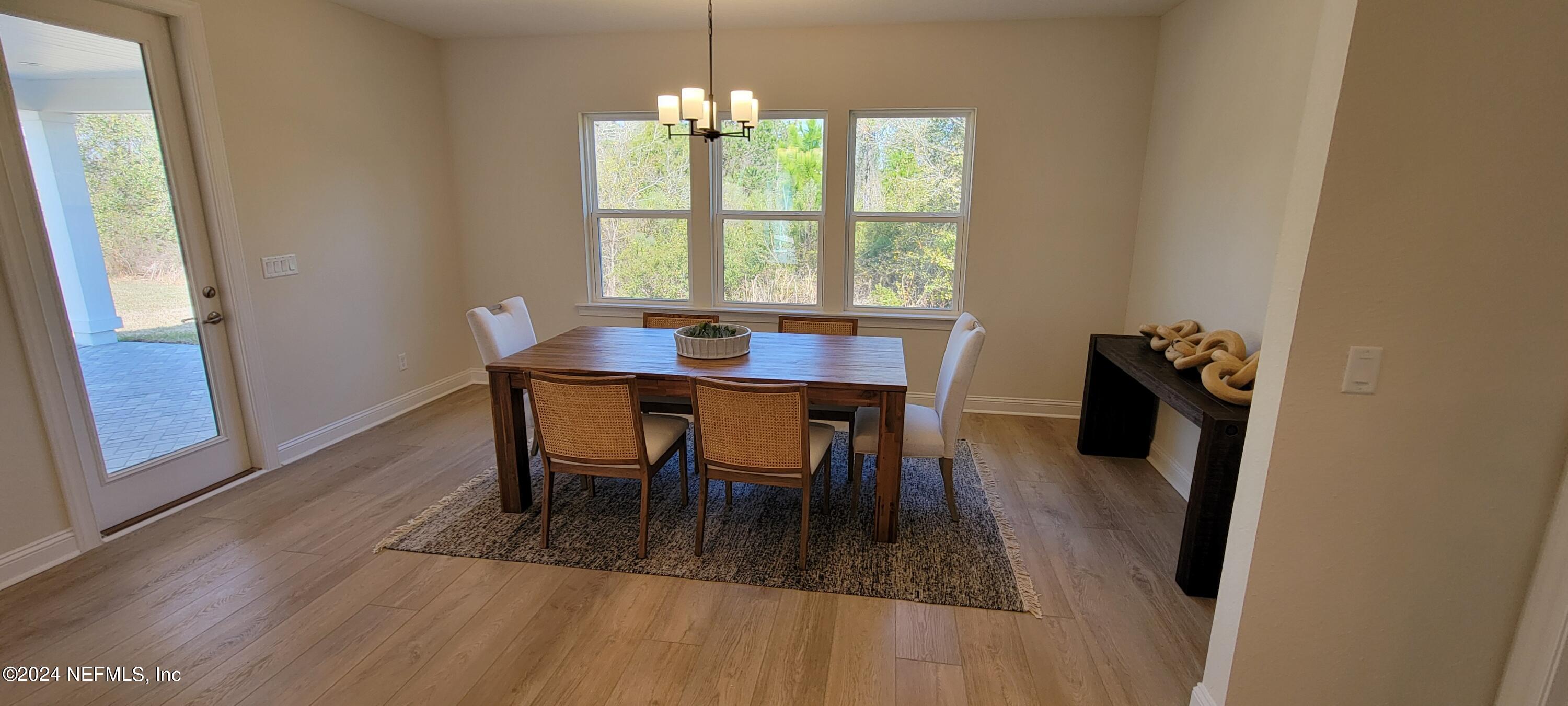 307 Ranch Land Circle St. Johns, FL 32259 - Photo 13 of 95 a dining room with furniture and window