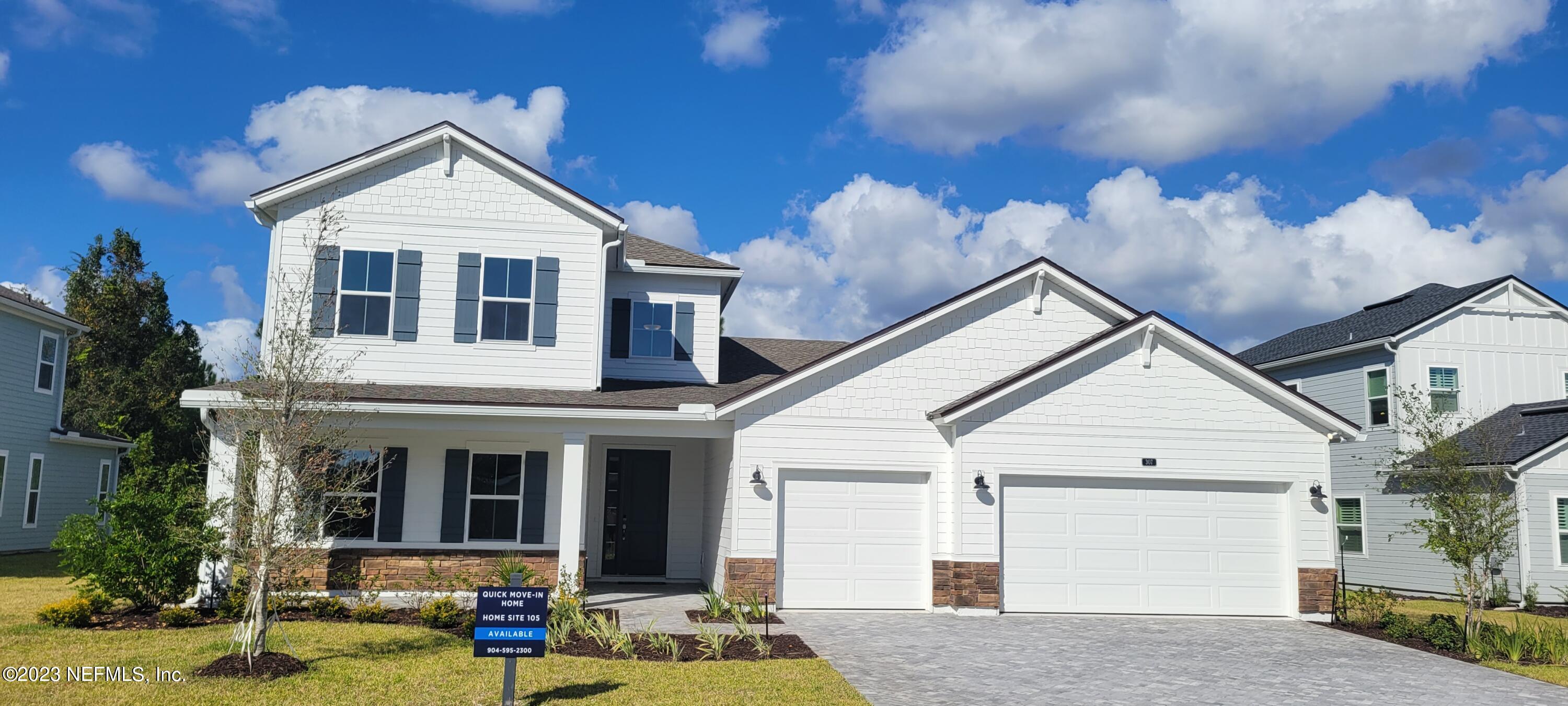 307 Ranch Land Circle St. Johns, FL 32259 - Photo 2 of 95 a front view of a house with garden