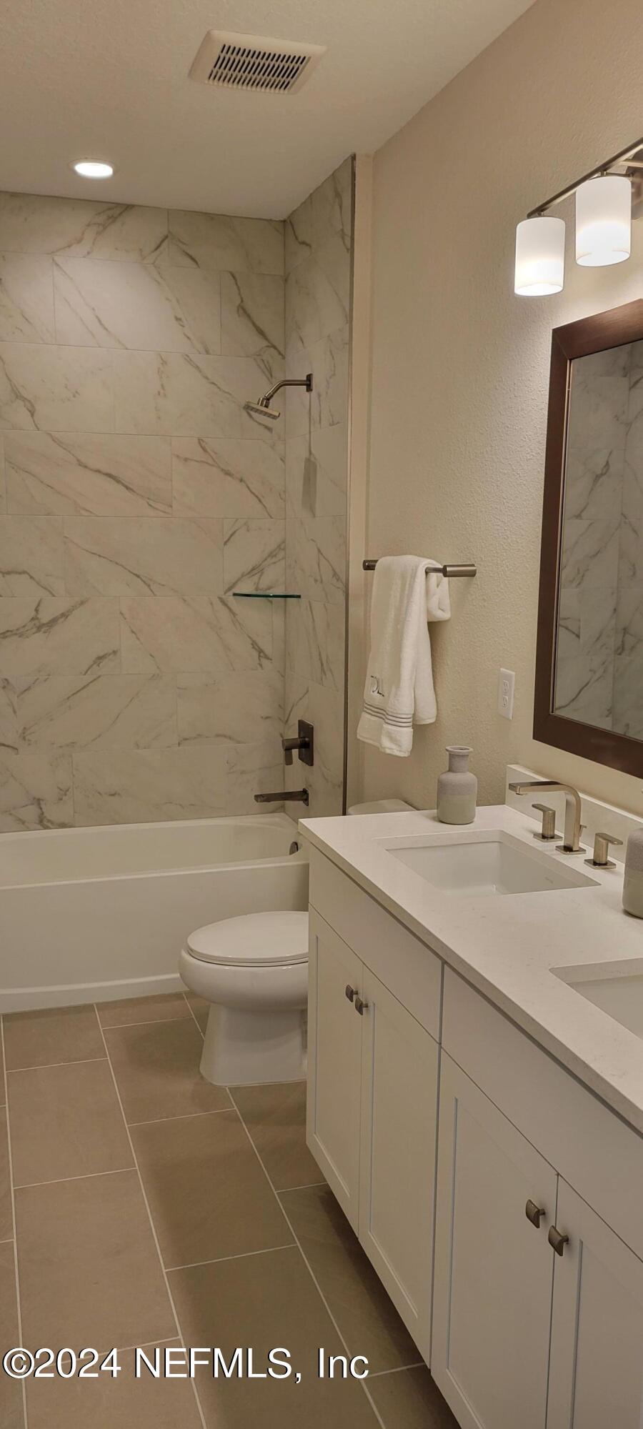 307 Ranch Land Circle St. Johns, FL 32259 - Photo 26 of 95 a bathroom with a sink a toilet and shower