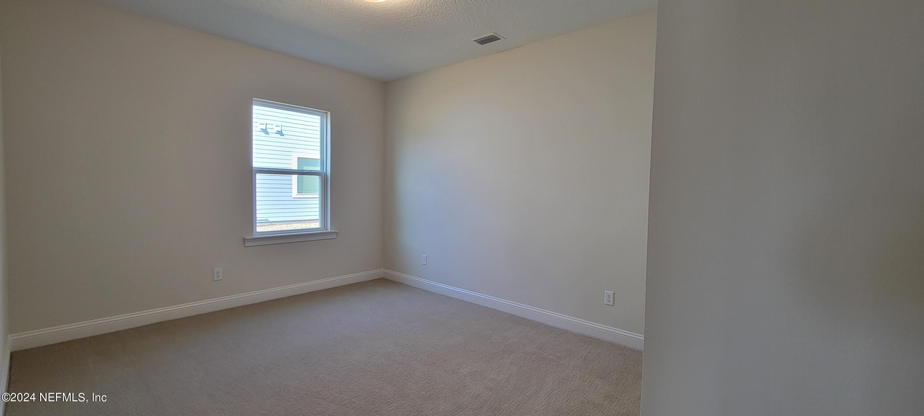 307 Ranch Land Circle St. Johns, FL 32259 - Photo 29 of 95 an empty room with a window