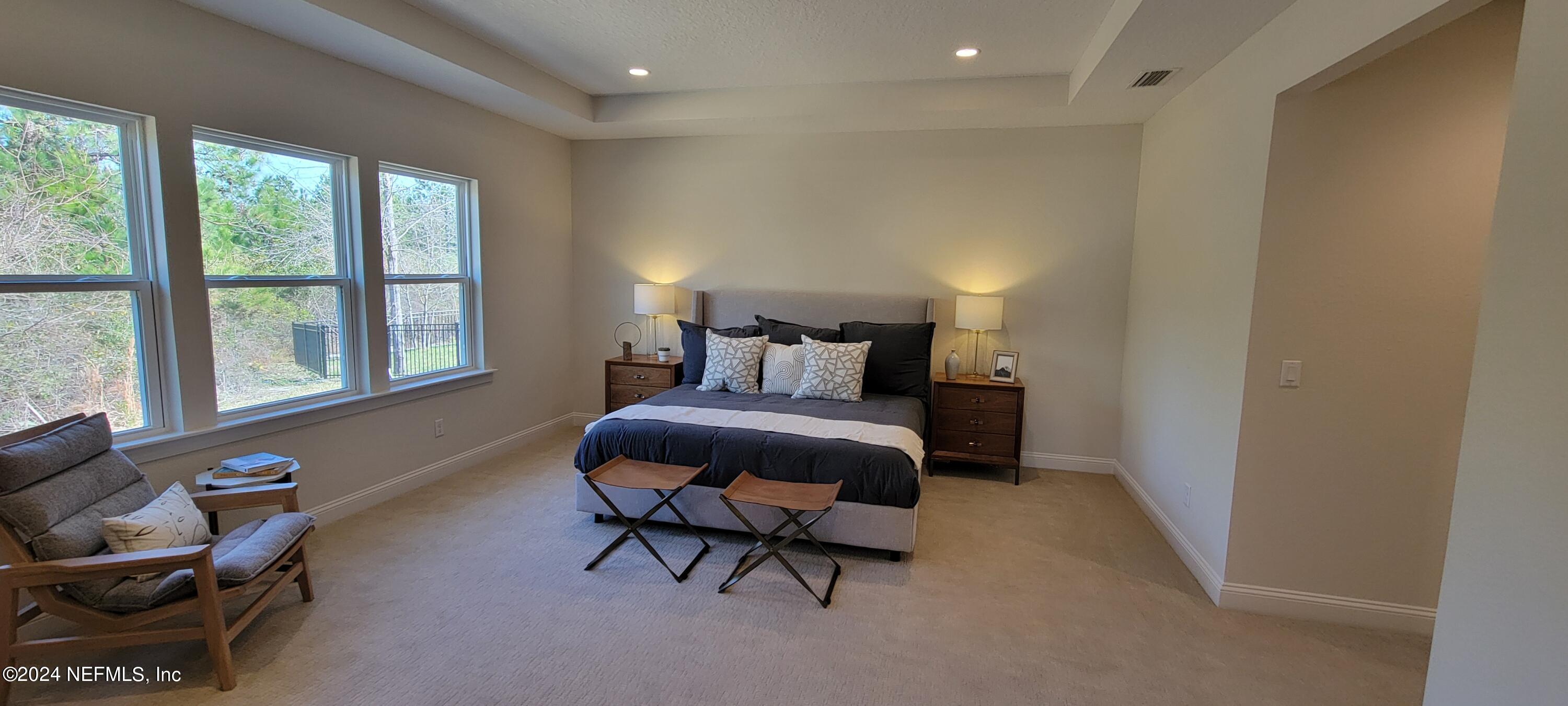 307 Ranch Land Circle St. Johns, FL 32259 - Photo 44 of 95 a bedroom with furniture and a window