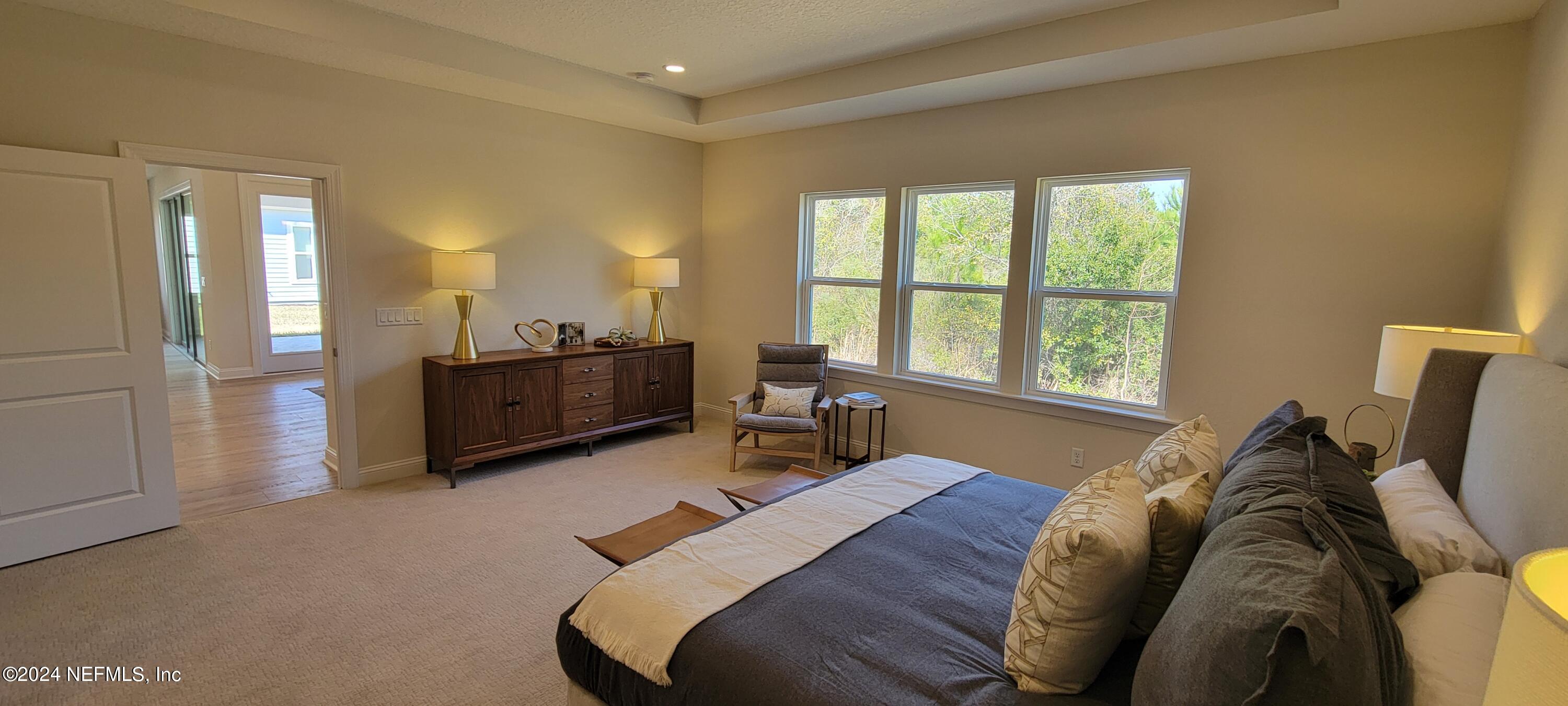 307 Ranch Land Circle St. Johns, FL 32259 - Photo 45 of 95 a bed room with a bed and a chair