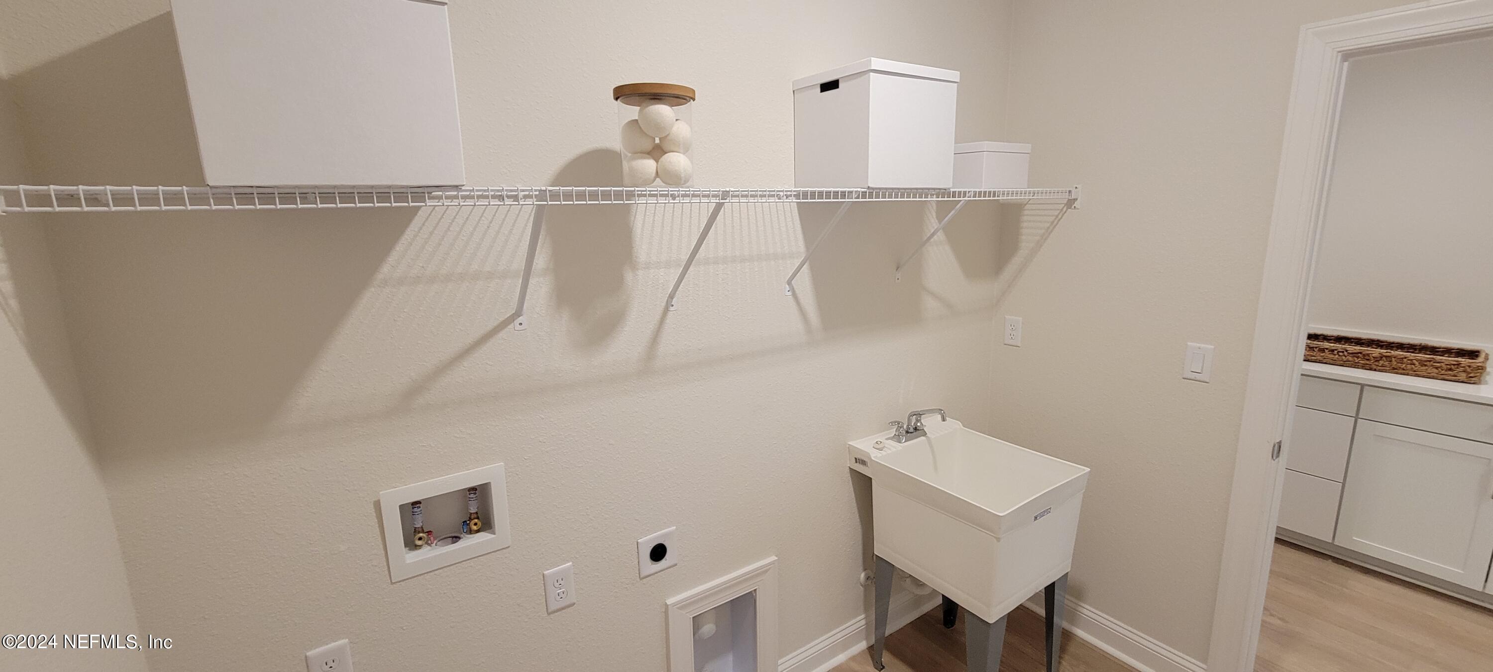 307 Ranch Land Circle St. Johns, FL 32259 - Photo 57 of 95 a bathroom with a sink and a mirror