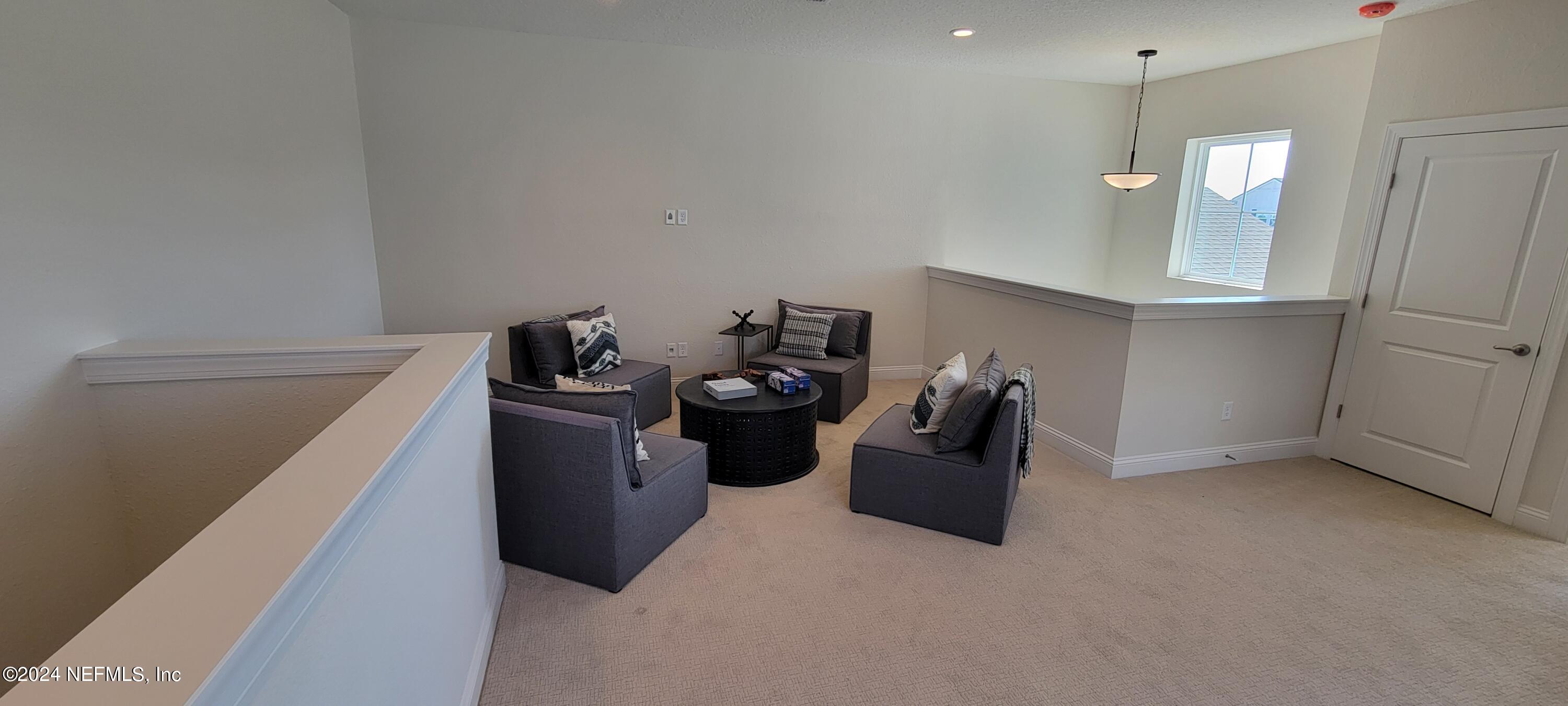 307 Ranch Land Circle St. Johns, FL 32259 - Photo 61 of 95 a kitchen with a refrigerator and white cabinets
