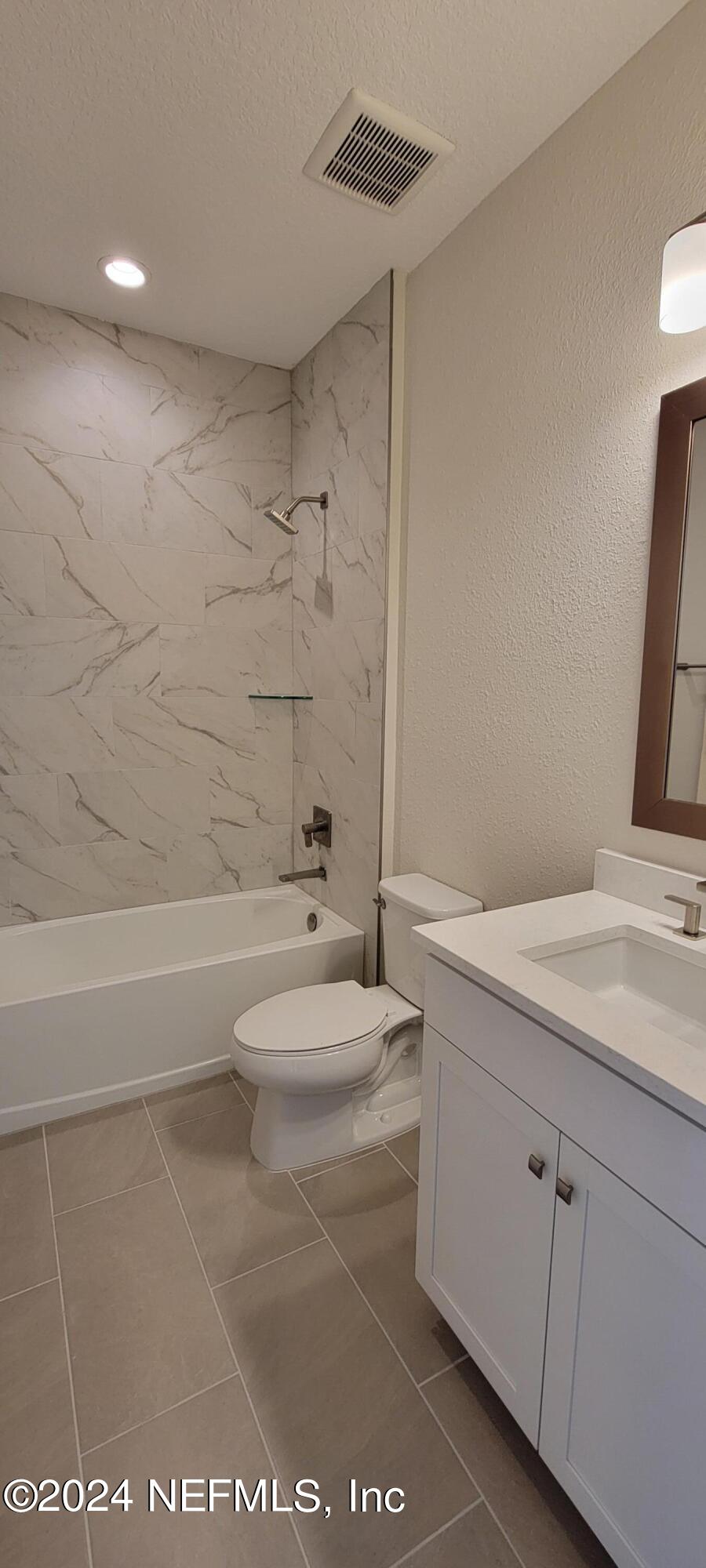 307 Ranch Land Circle St. Johns, FL 32259 - Photo 66 of 95 a bathroom with a sink a toilet and shower