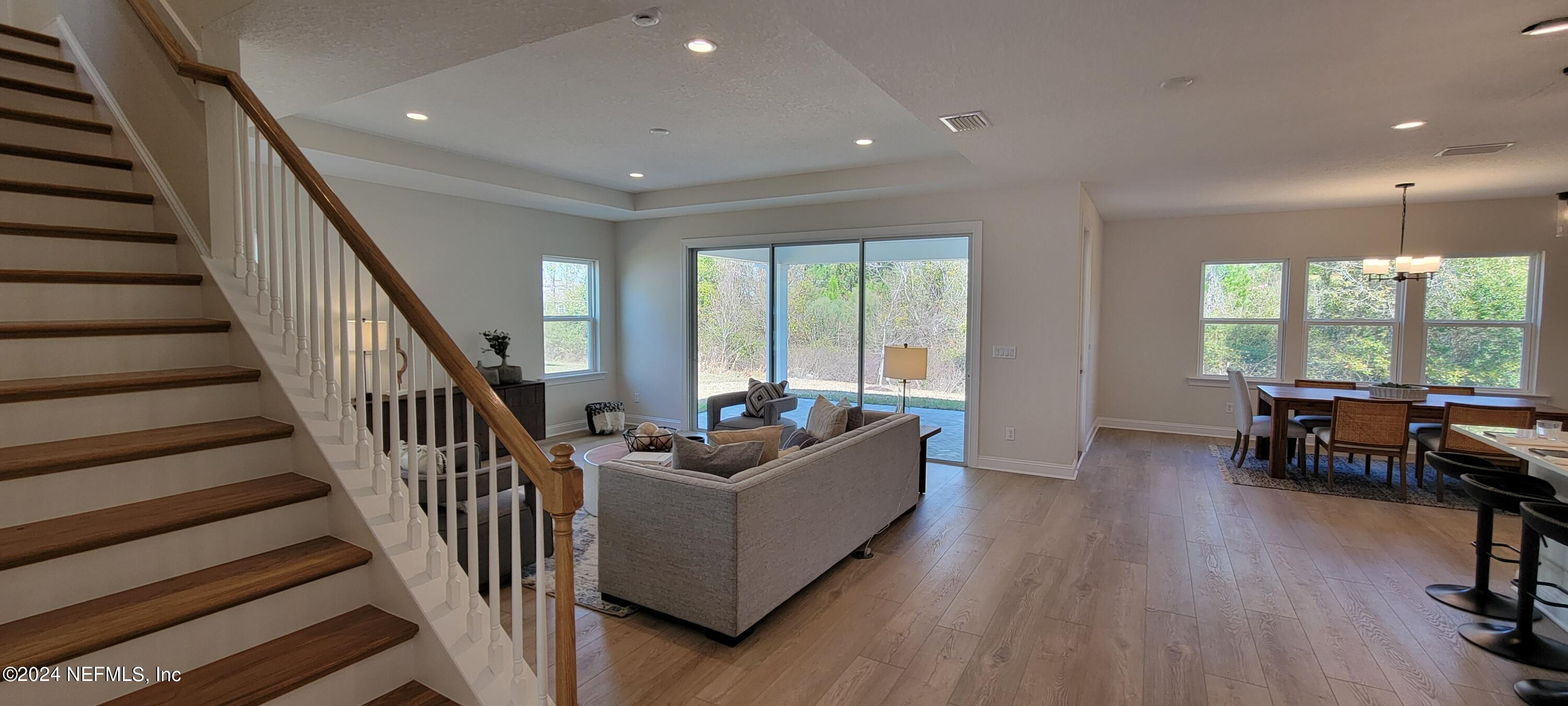 307 Ranch Land Circle St. Johns, FL 32259 - Photo 7 of 95 a living room with furniture and a large window