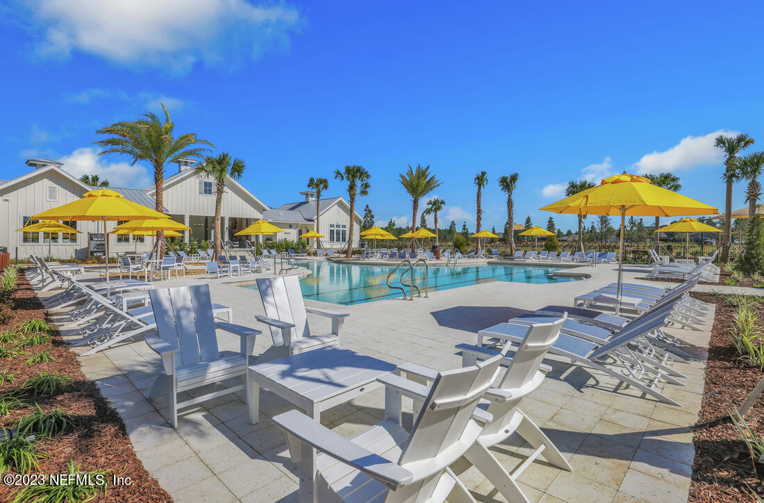 307 Ranch Land Circle St. Johns, FL 32259 - Photo 71 of 95 a view of a swimming pool with outdoor seating space